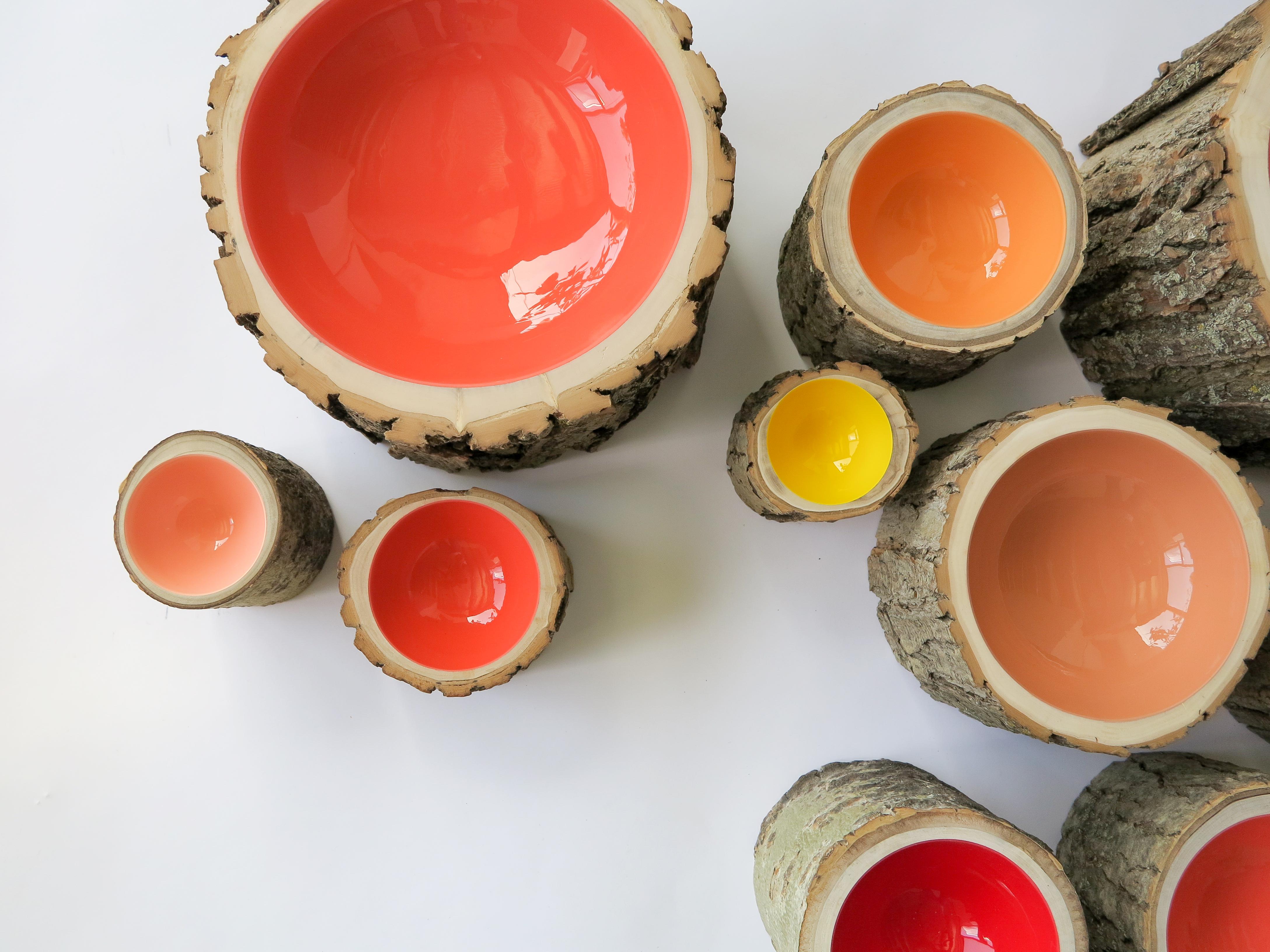 Log bowls combine the beauty of a tree in its natural state with a high-gloss, vibrant finish. Each bowl is handmade using locally reclaimed trees of all varieties (fallen or cut down due to infrastructure or inclement weather). The trees are hand