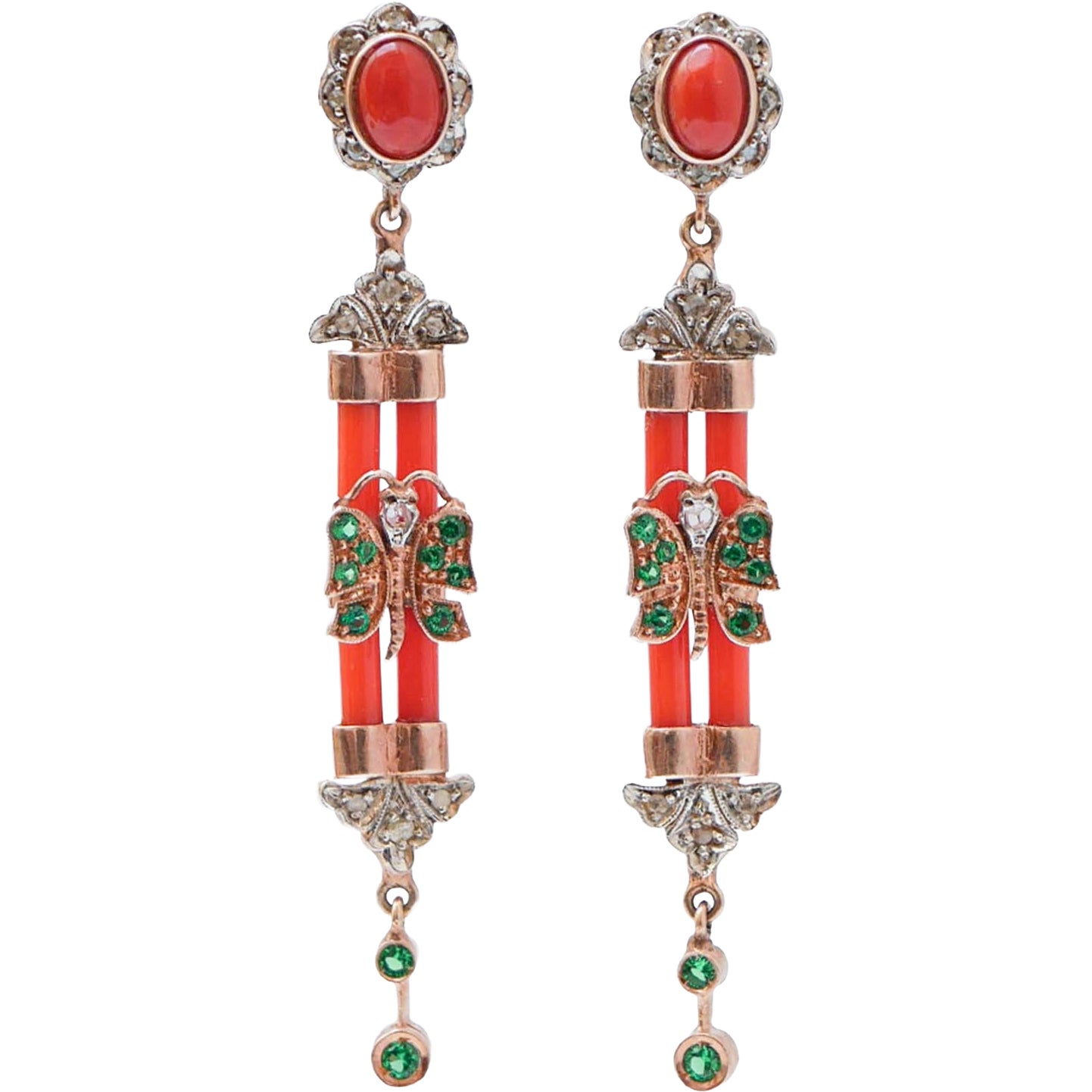Orecchini in corallo, spinello, diamanti, oro rosa e argento.