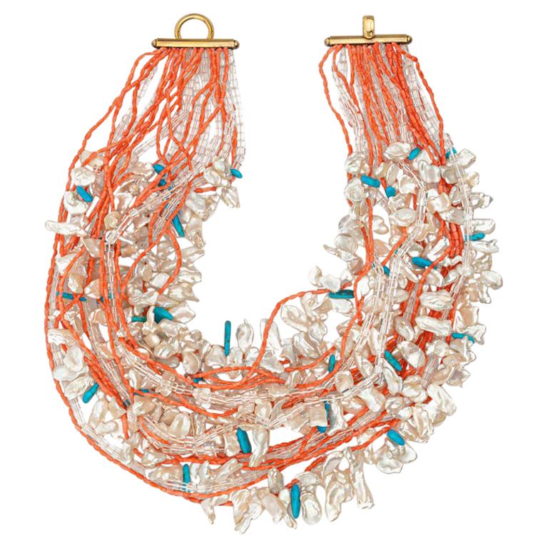 Collana con perline di corallo e turchese con pepite di cristallo e perle in argento dorato 925