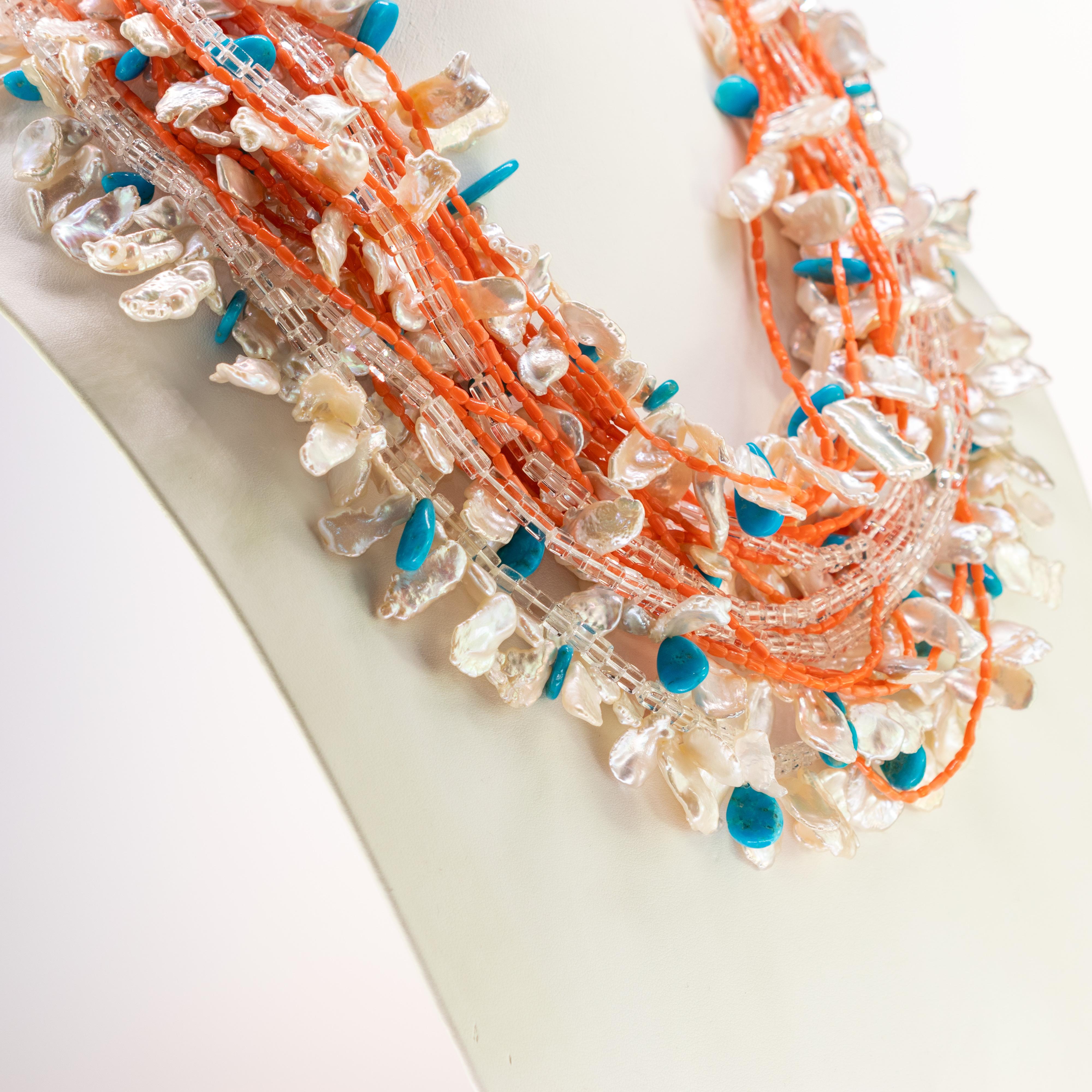 Stunning multi-strand necklace with rock crystal, pearls, coral and turquoise. This epic necklace is an outstanding display of color and Italian craftsmanship. 

This design is inspired by the magnificent Koi Fish, symbol of aspiration and wealth. A