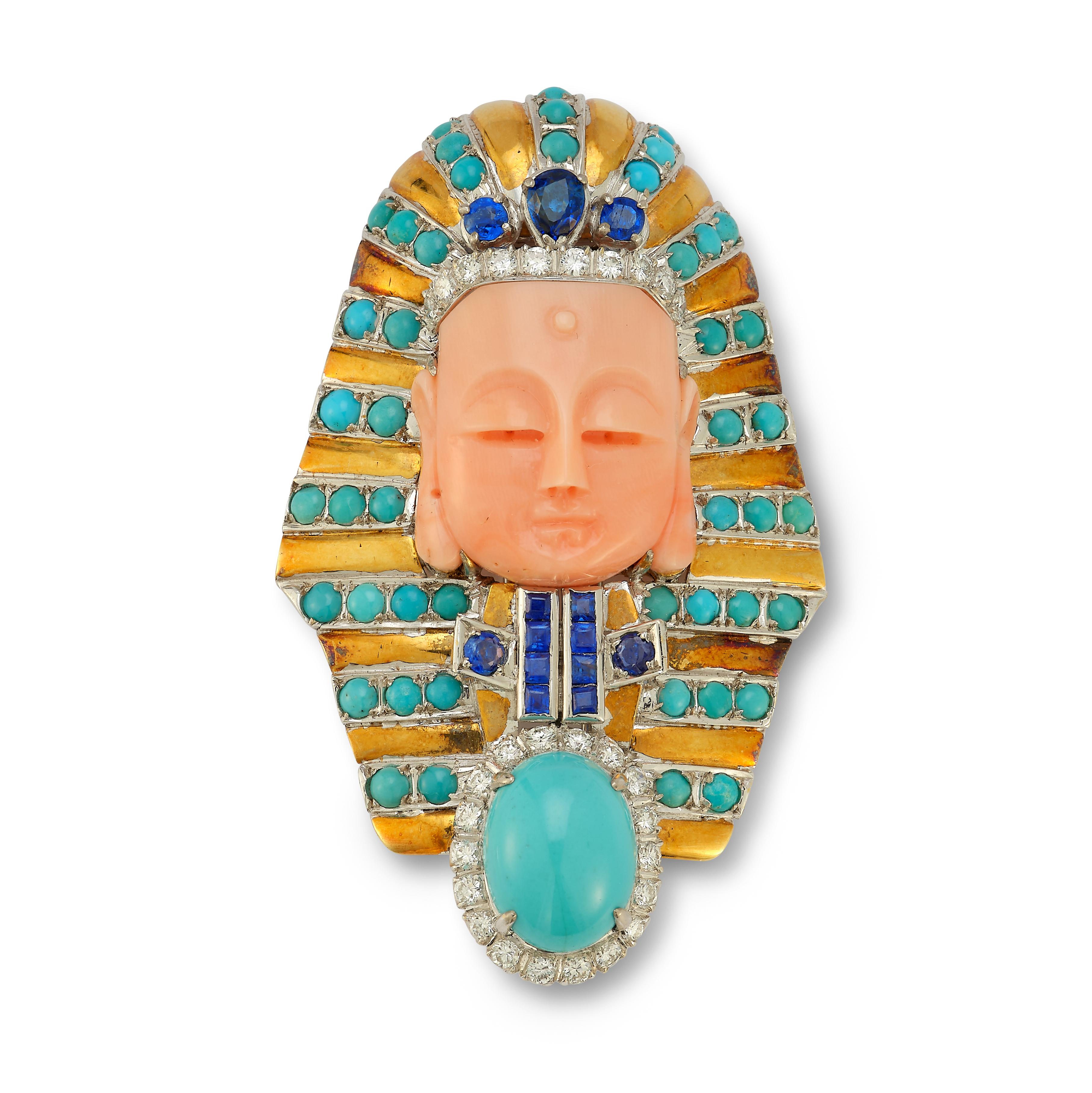 Coral & Turquoise Egyptian Mortive Brooch By Trio

1 carved coral face set with sapphires & cabochon turquoise  approximately .90 cts  & round cut diamonds approximately .65 cts.

Measurements: 2.5