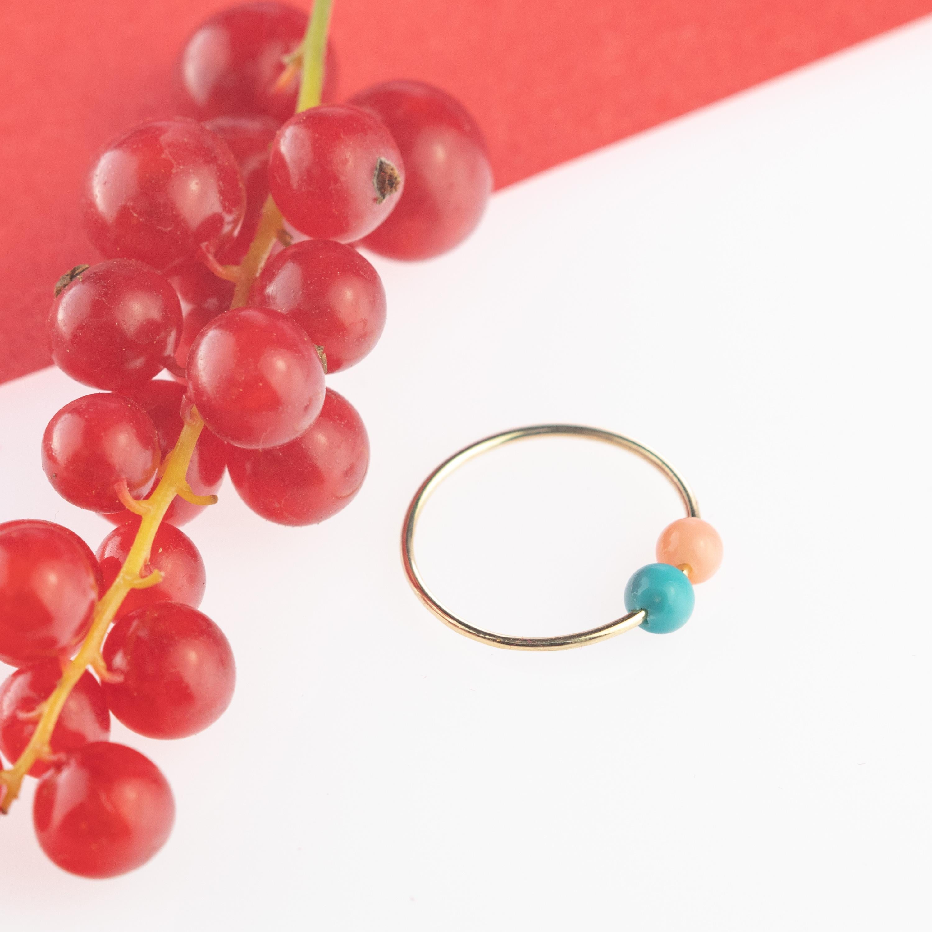 Signature INTINI Jewels Asteroid Planet ring. Contemporary ring design in 9 karat yellow gold with a precious coral and turquoise beads.  Passion and intensity mixed in one jewel. Delight yourself with a strong, minimalist design, just for a