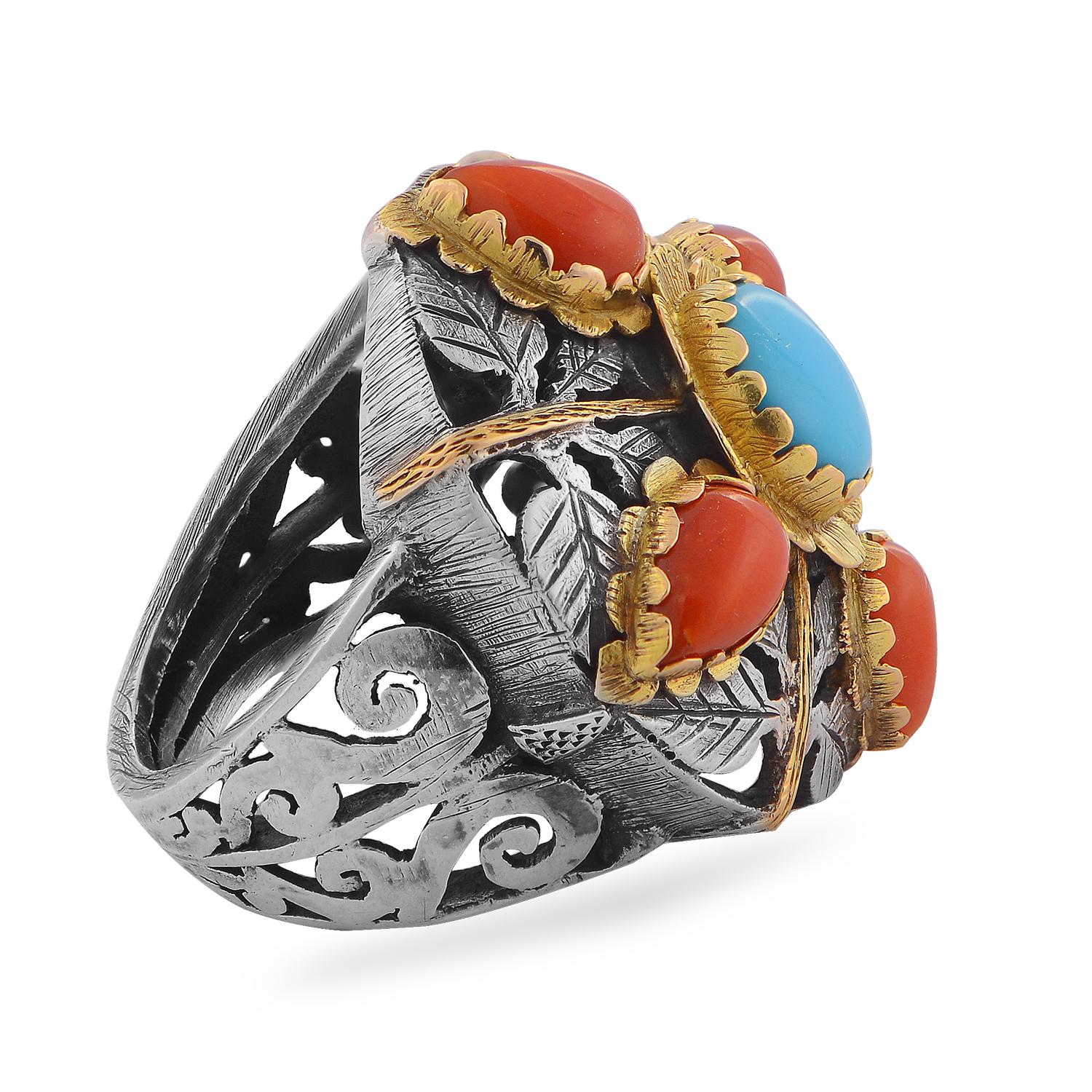 This striking one of a kind ring has been handmade in our workshops. It has intricate hand engraved floral and geometric motifs on it in oxidized sterling silver and 18kt gold.  The ring is embedded with turquoise and corals.

Ring dimensions - 25mm