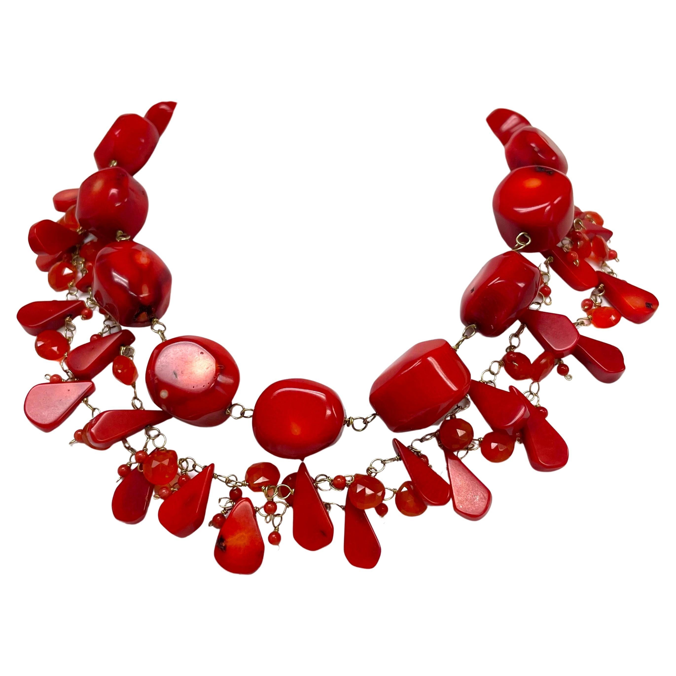 Description
This bold, yet elegant vibrant three strand statement necklace expresses your own personal flair. The uncommon mix of Coral and Carnelian with the contrast of large and delicate hand wire-wrapped stones is what makes this necklace very