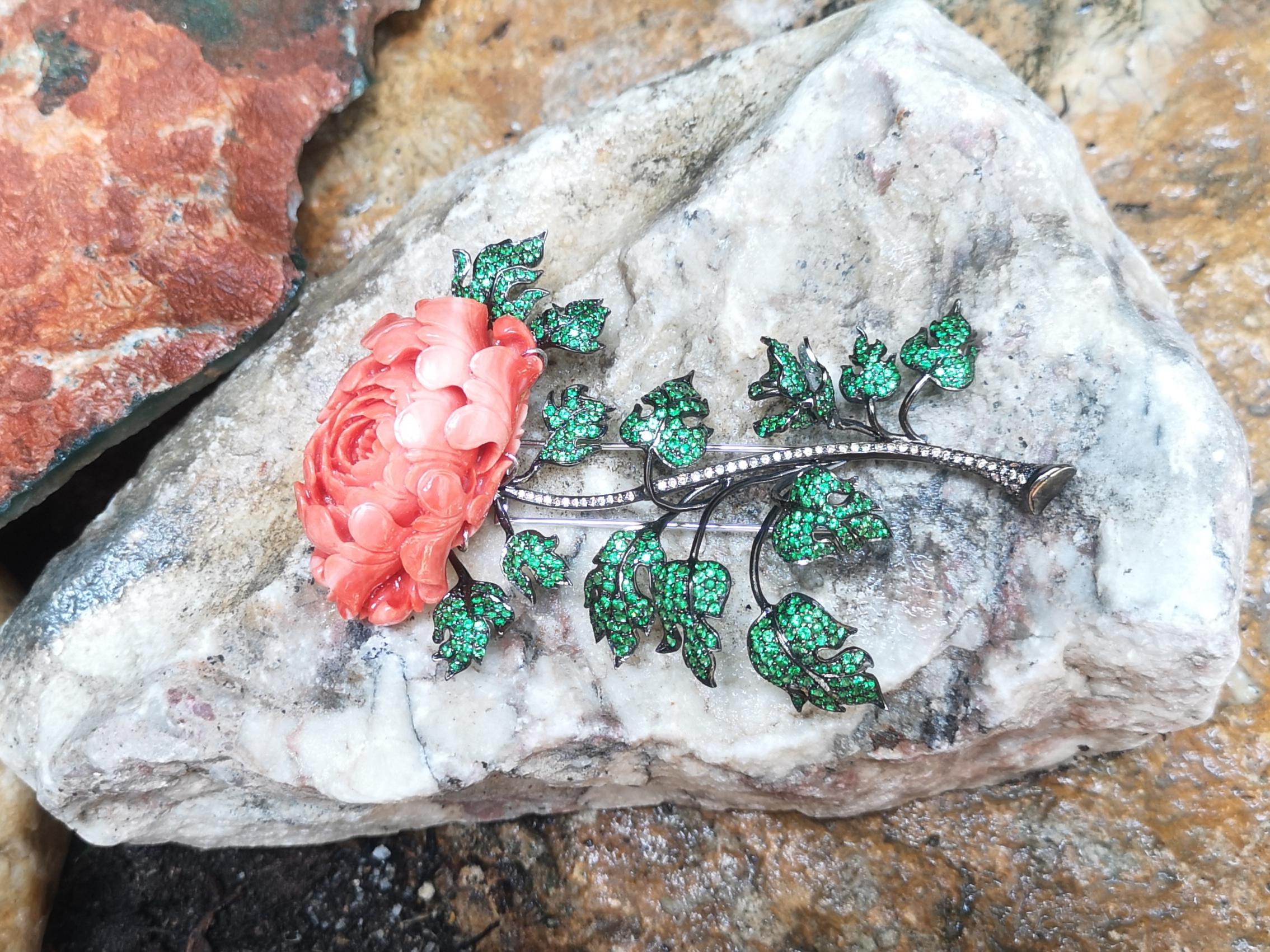 Coral 112.50 carats with Tsavorite 8.99 carats and Brown Diamond 0.88 carat Brooch set in 18 Karat White Gold Settings

Width:  7.0 cm 
Length: 11.5 cm
Total Weight: 73.58 grams

