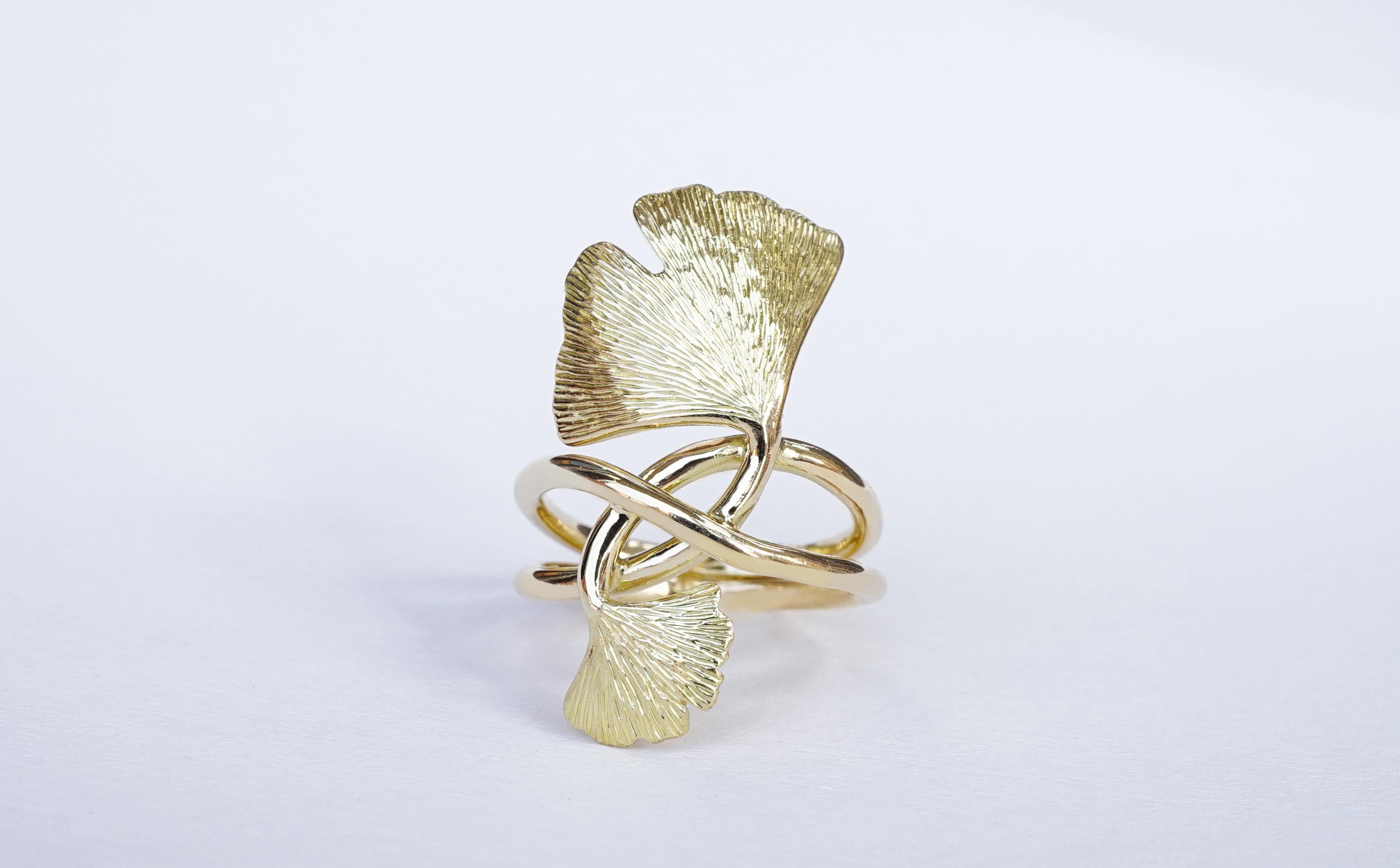Coralie Van Caloen 18k Gold Gingko Ring is entirely hand made and forged in Belgium by experts goldsmiths therefore it is a very unique piece. The gingko leaves twist around the finger to form an elegant band ring. The leaves are hand engraved in