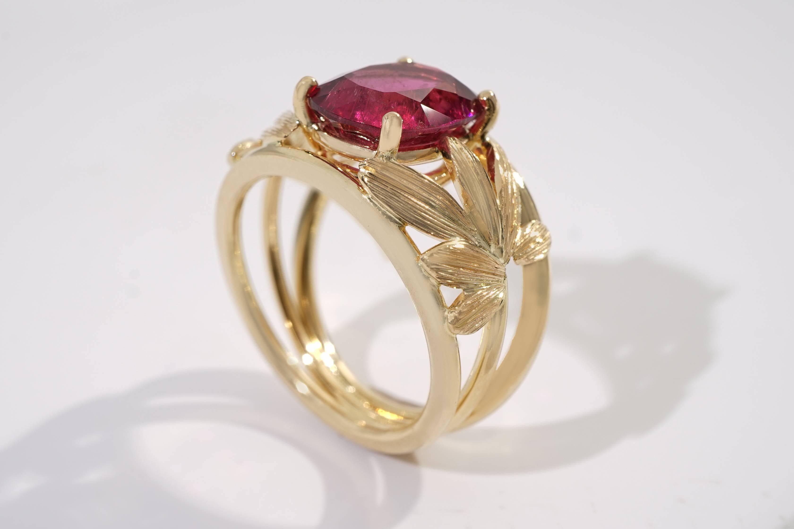 Coralie Van Caloen Yellow Gold 18 Carat Band Ring With Hand Engraved Palm Tree Leaves is entirely hand made and forged in Belgium by experts goldsmiths therefore it is a very unique piece. The Rubellite has an unusual hot pink colour and beautiful