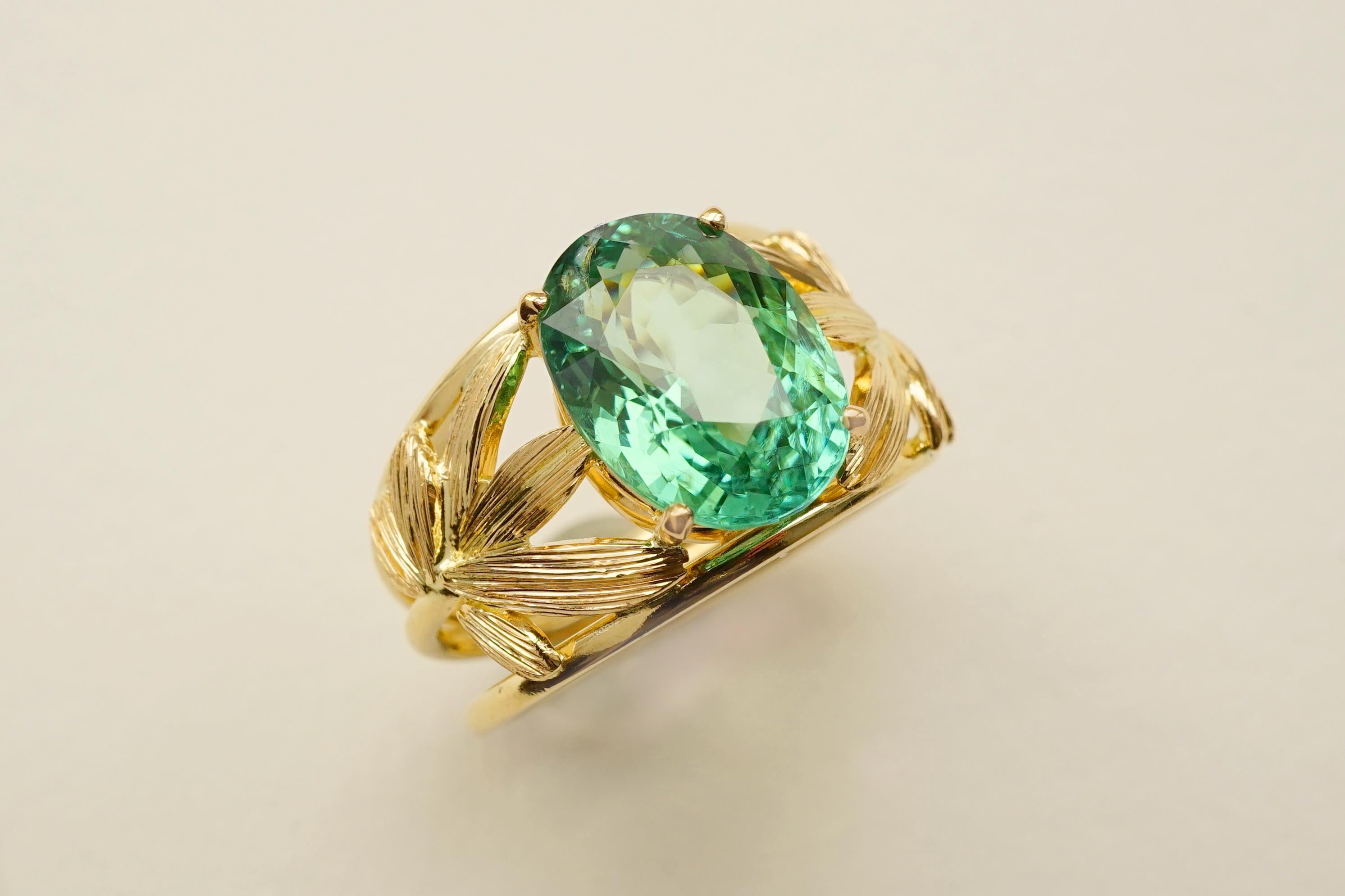 Coralie Van Caloen Yellow Gold 18k Palm Leaves Paraiba Tourmaline Cocktail Ring is entirely hand made and forged in Belgium by experts goldsmiths therefore it is a very unique piece. The colour of the Paraiba Tourmaline is as bright and luminous as