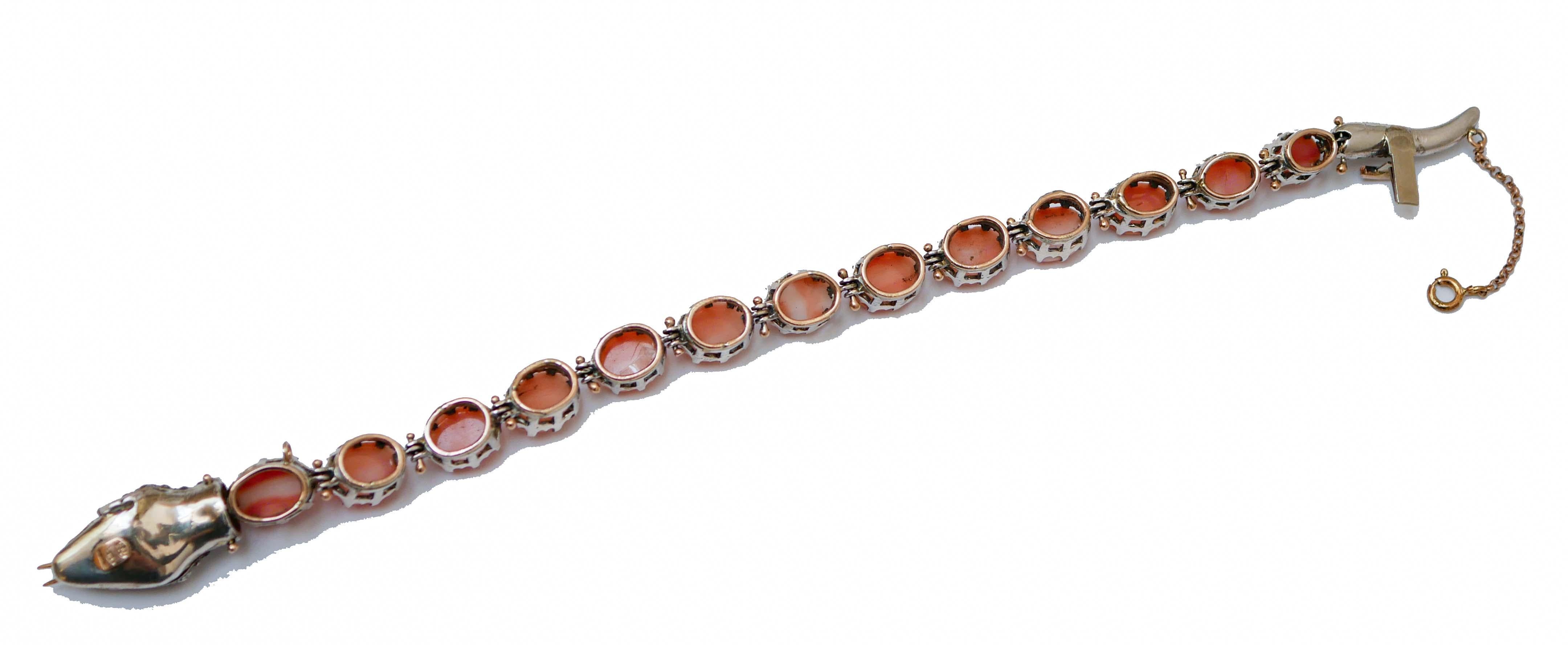 Rétro Bracelet serpent en or rose et argent, corail, émeraudes, tsavorites et diamants en vente