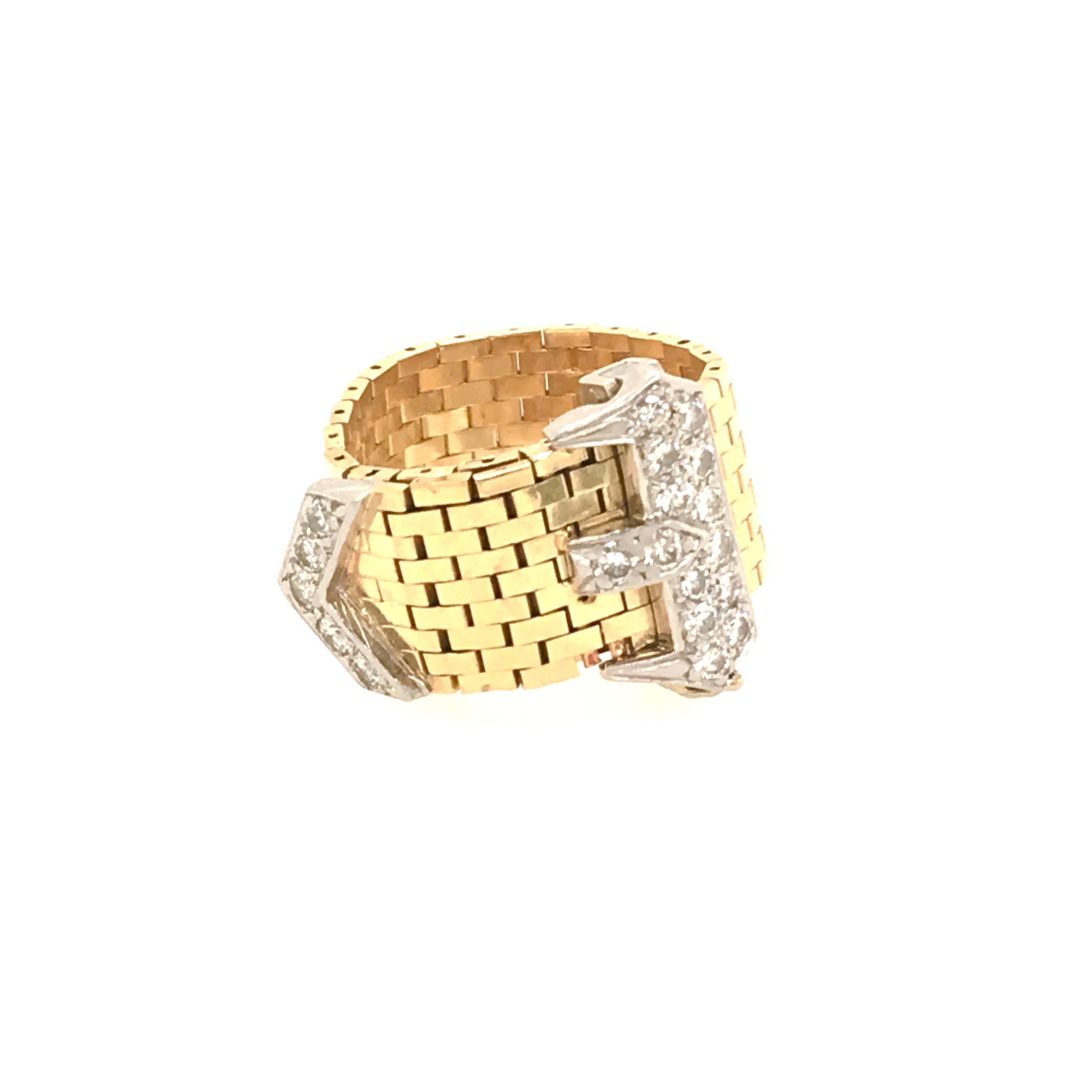 A 14 karat yellow gold and diamond ring. Corbett & Bertolone. Circa 1950. Of brick link design, joined by a pave set diamond buckle. Diamonds weigh approximately 0.60 carat. size is approximately 6, gross weight is approximately 10.4 grams. With