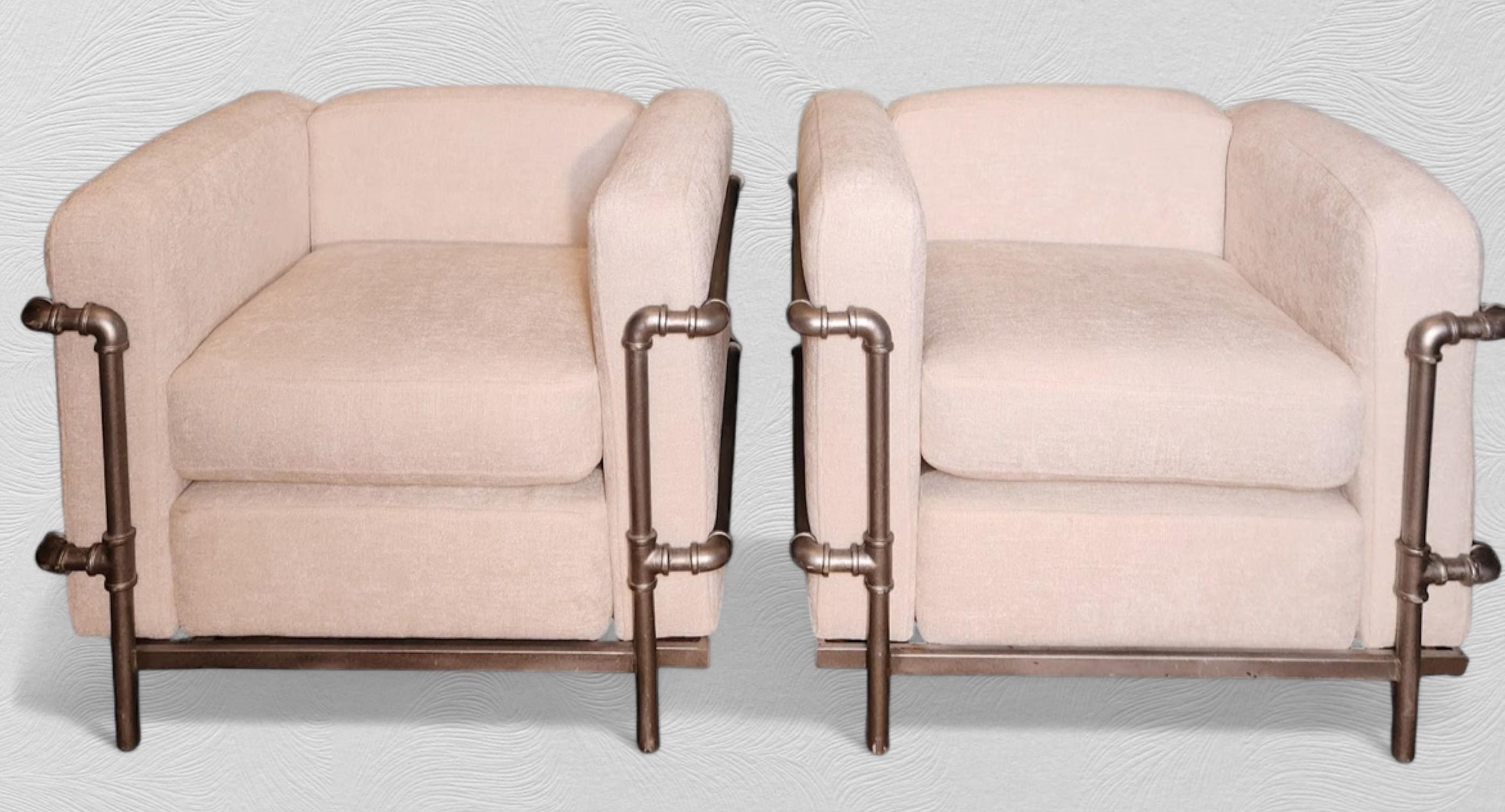 A pair of lounge chairs based on Perriand, Le Corbusier & Jeanneret iconic 1928  