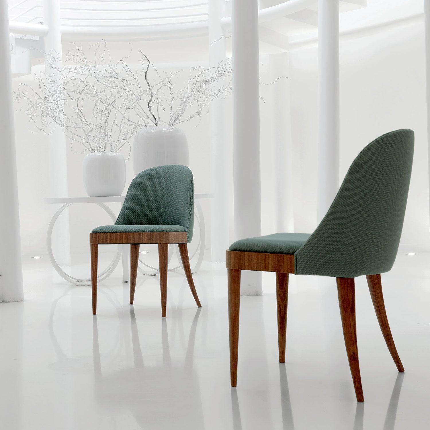 Cordiale Chair by Dale Italia
Dimensions: D 43 x W 47 x H 83 cm.
Materials: Walnut and fabric/leather. 

Upholstered armchair in solid Canaletto walnut. Available in different upholstery options and grey/natural walnut finishes. Also available with