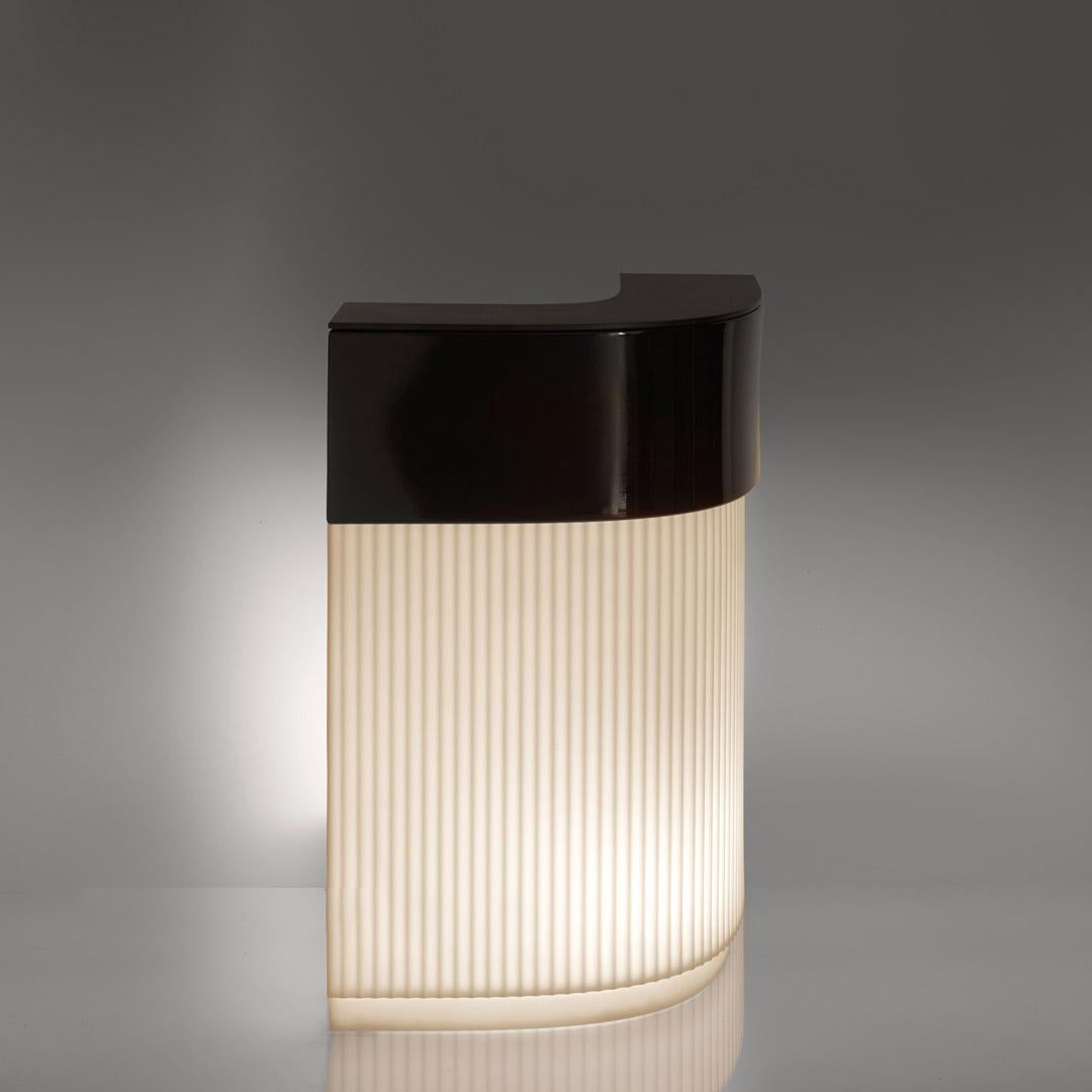 Cordiale Corner Bar Counter by Roberto Paoli
Dimensions: D 70 x W 70 x H 110 cm.
Materials: Polyethylene.

This product is suitable for indoor and outdoor use. Available in a lighted version. Additional details on glass or steel can be added upon