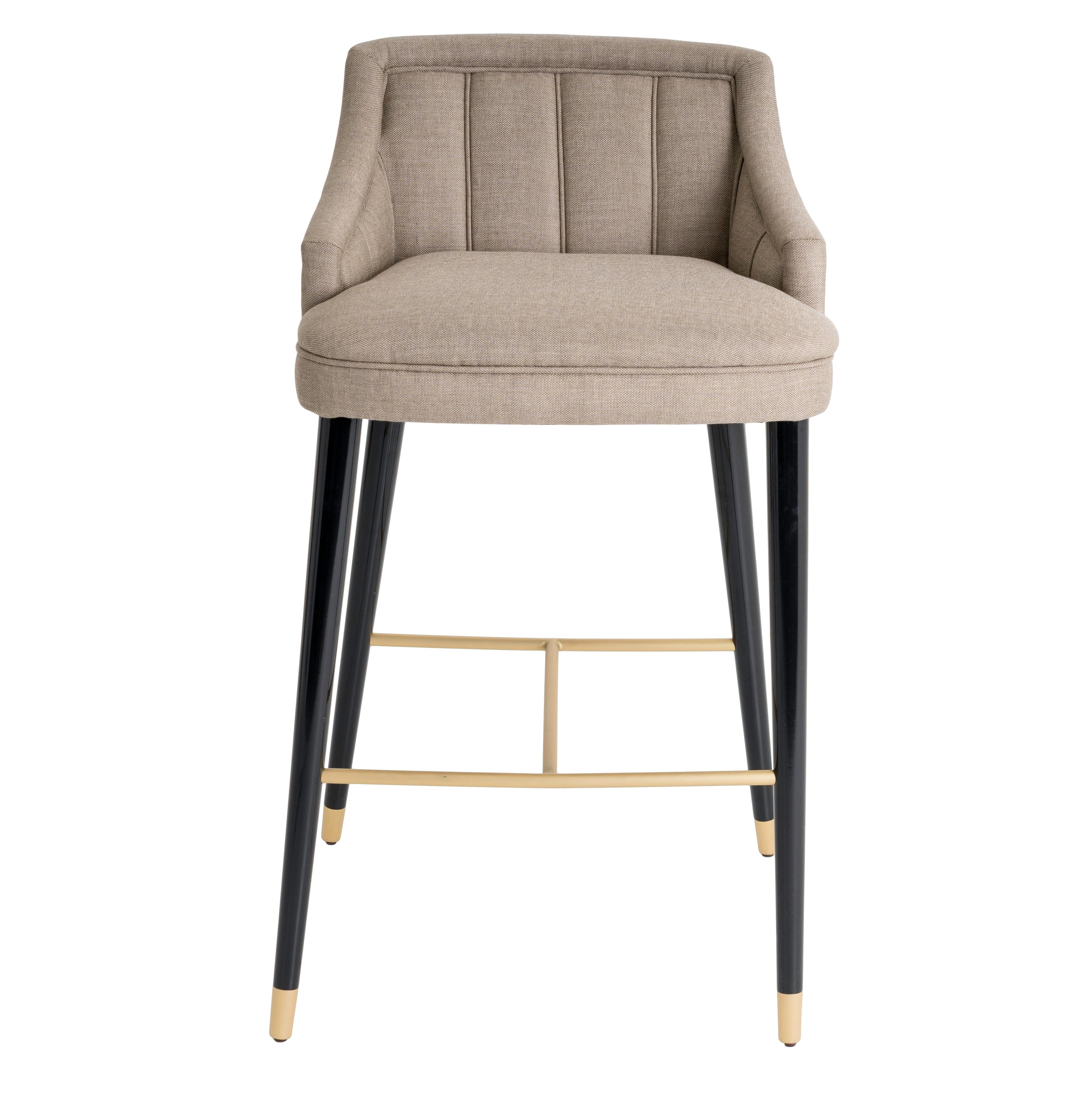 With an elegant and timeless design, the high stool CORDOBA is upholsered in fabric, while the legs are lacquered and equipped with footrests and brass feet.‎ Cordoba is available in fabric, leather, eco-leather or COM and is possible to customize