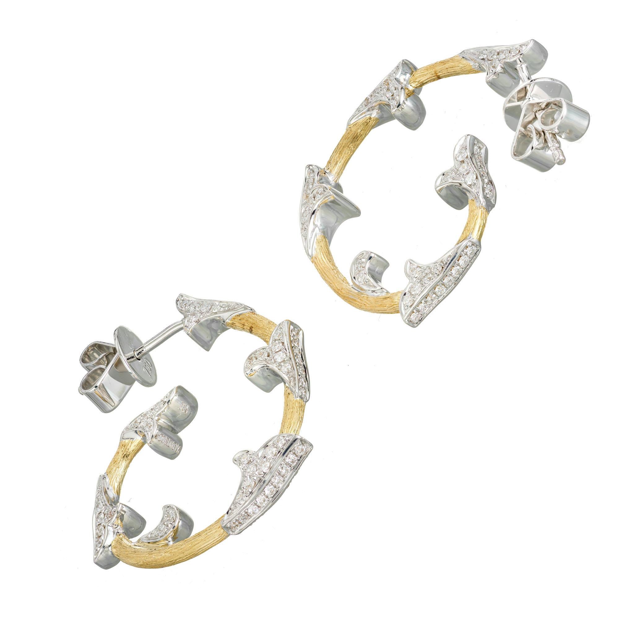 Cordova 18k white and yellow gold hoop earrings with post style tops. 190 round full cut diamonds set in white gold along yellow gold hoops. 

190 round full cut diamonds, approx. total weight .63cts, F, VS
18k yellow and white gold
Tested: