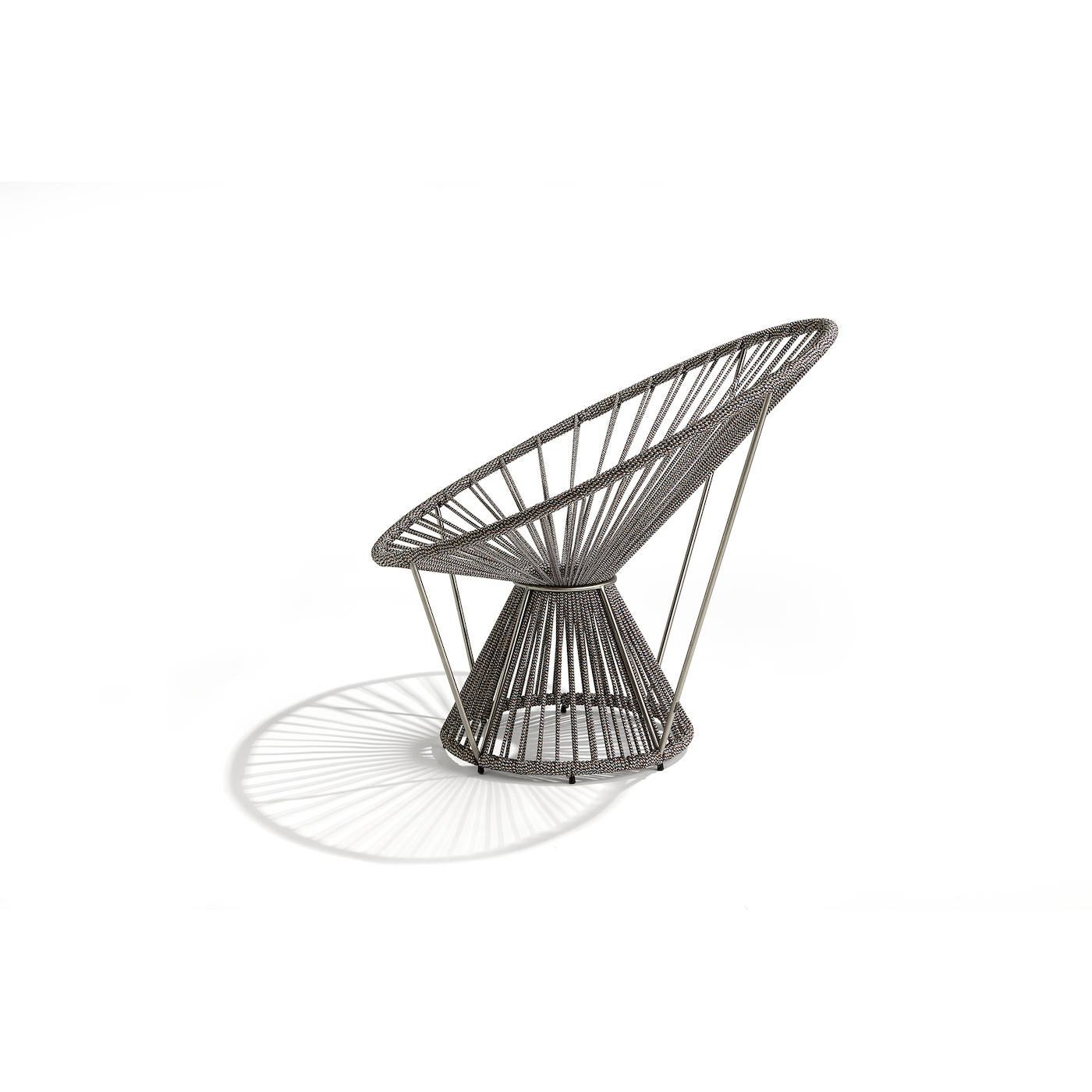 Revisiting the iconic shape of the Acapulco chair with a modern flair, this armchair has a stainless steel frame composed of two truncated cones, connected by their tops and stabilized by four cables. The spokes are made of polyester rope with a