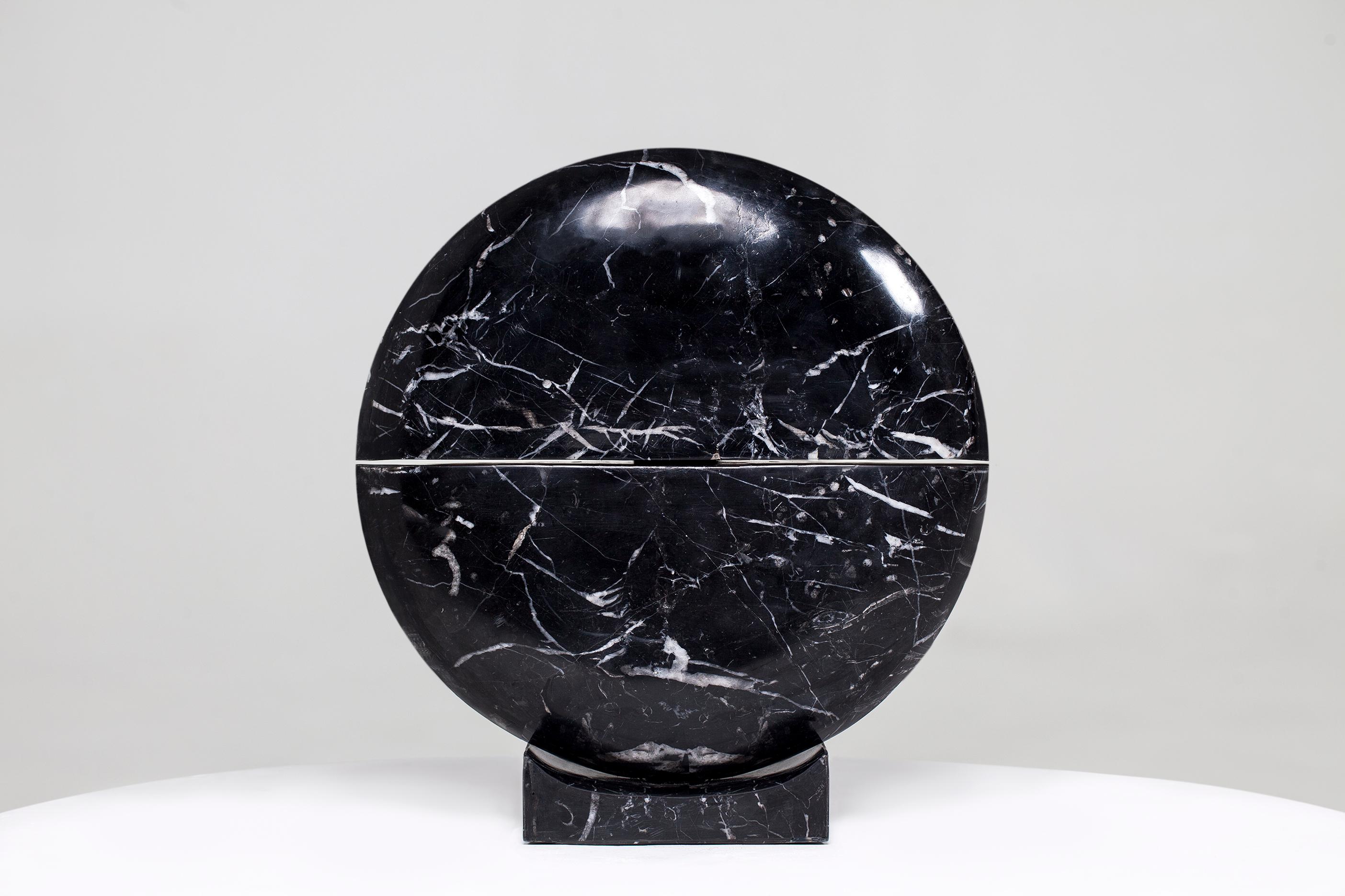 Core marble table lamp by Carlos Aucejo
Dimensions: 56 x 54 x 9 cm
Materials: Marquina marble

Core lamp 
This piece is made of Marquina marble. The composition comes from the idea of a growing nucleus. It has been developed through the philosophy