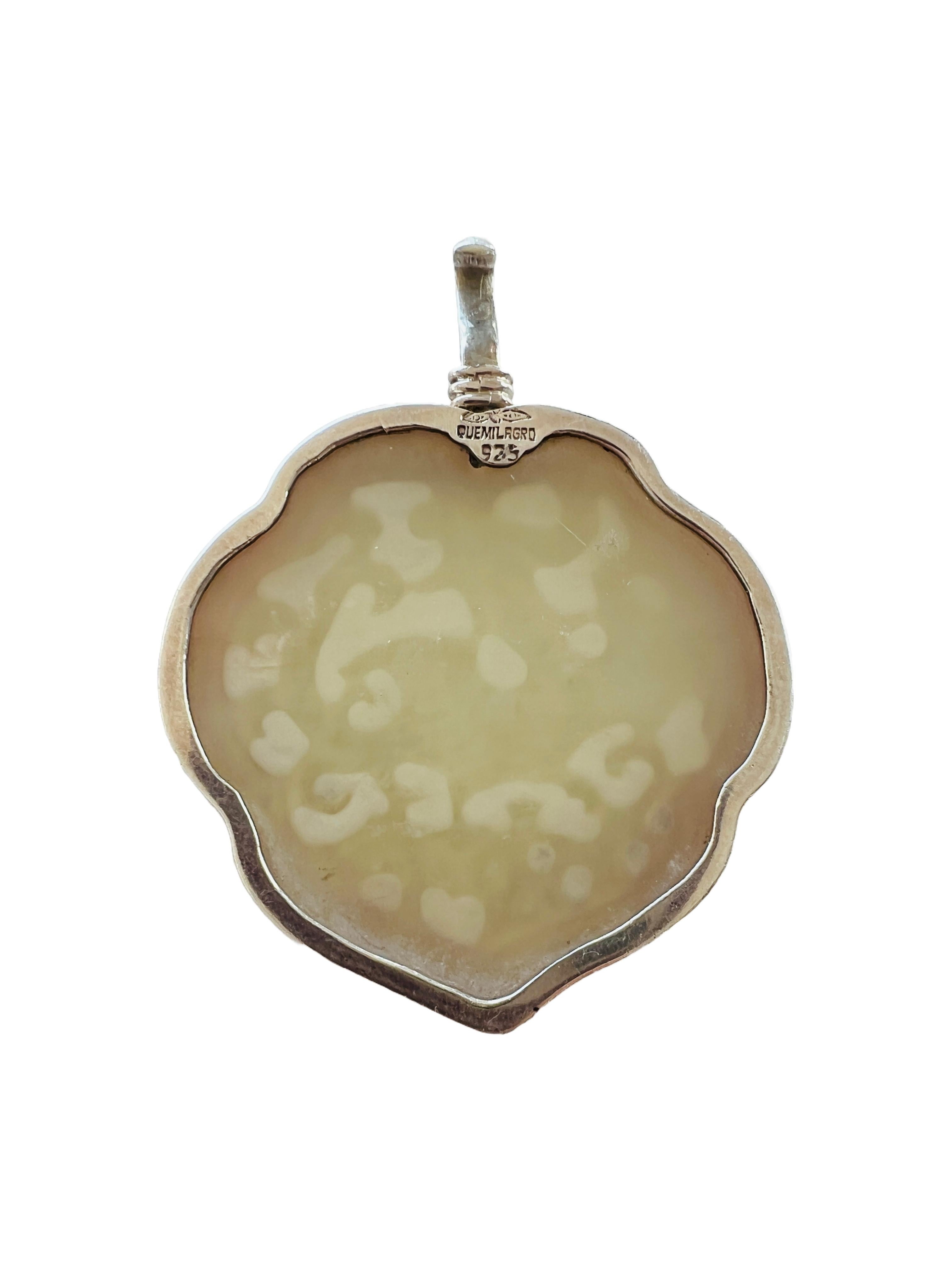 Please note: This listing is for the pendant only. The last three images featuring the chain are shown for reference and display purposes only.

This stunning carved gemstone pendant by Coreen Cordova beautifully blends cultural influences, crafted