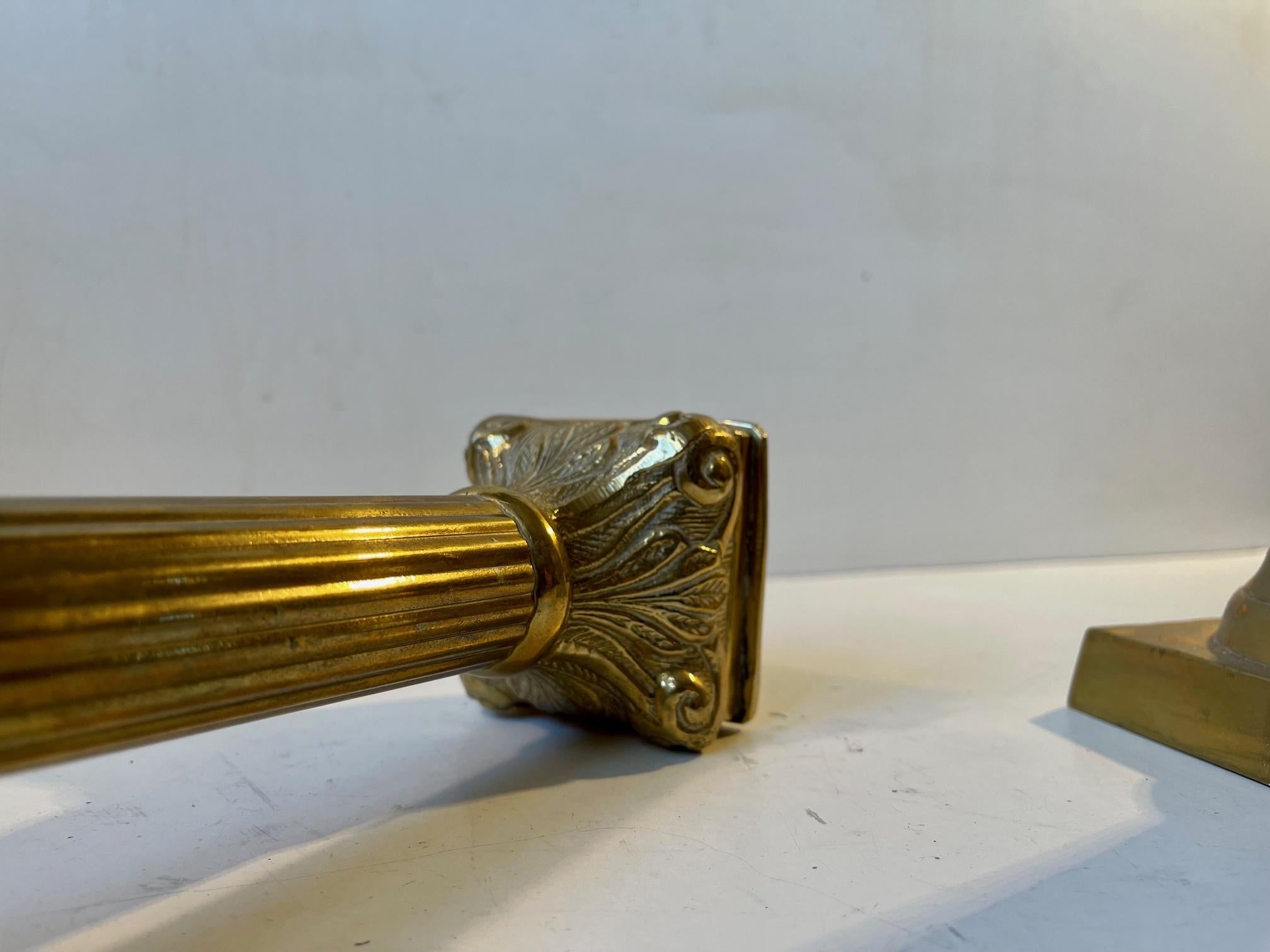 Cast Corinthian Column Candlesticks in Brass For Sale