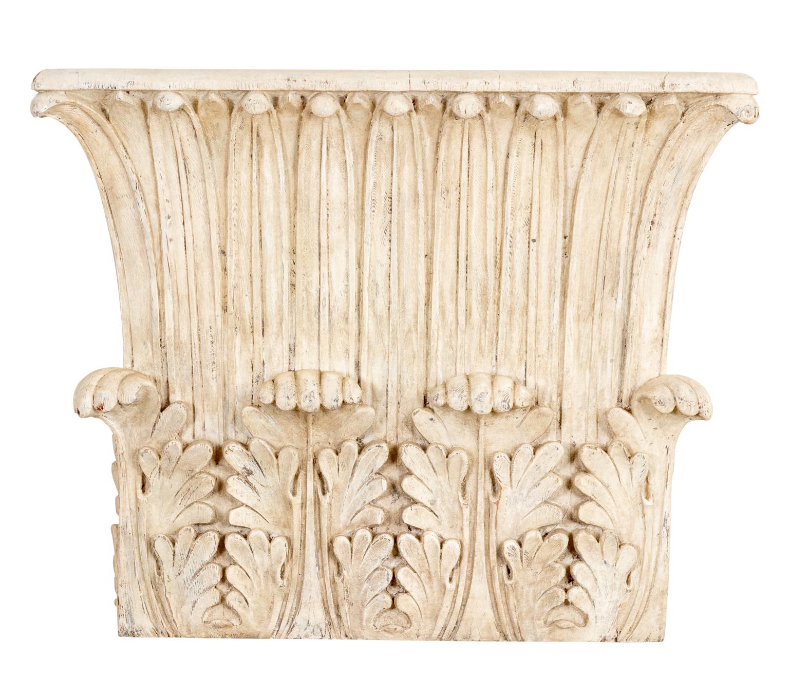 Circa mid-20th century pair of neoclassical style rectangular Corinthian capital shaped architectural carved wood wall brackets with layered acanthus leaves. Please note of wear consistent with age including chips, paint loss, and patina. Wires