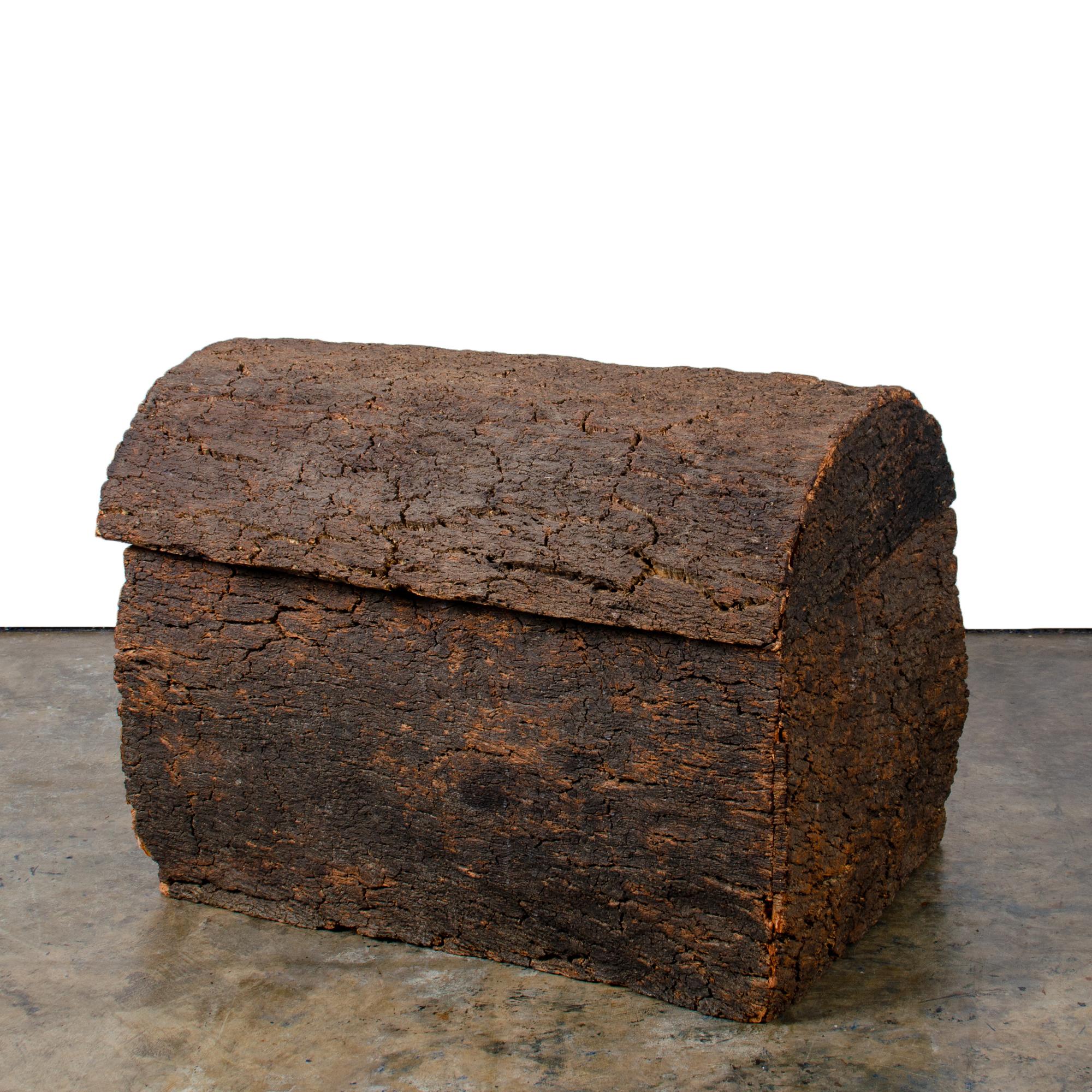 A unique vintage trunk made from the bark of a Cork Oak tree.

28 inches wide by 20 inches deep by 20 inches tall
