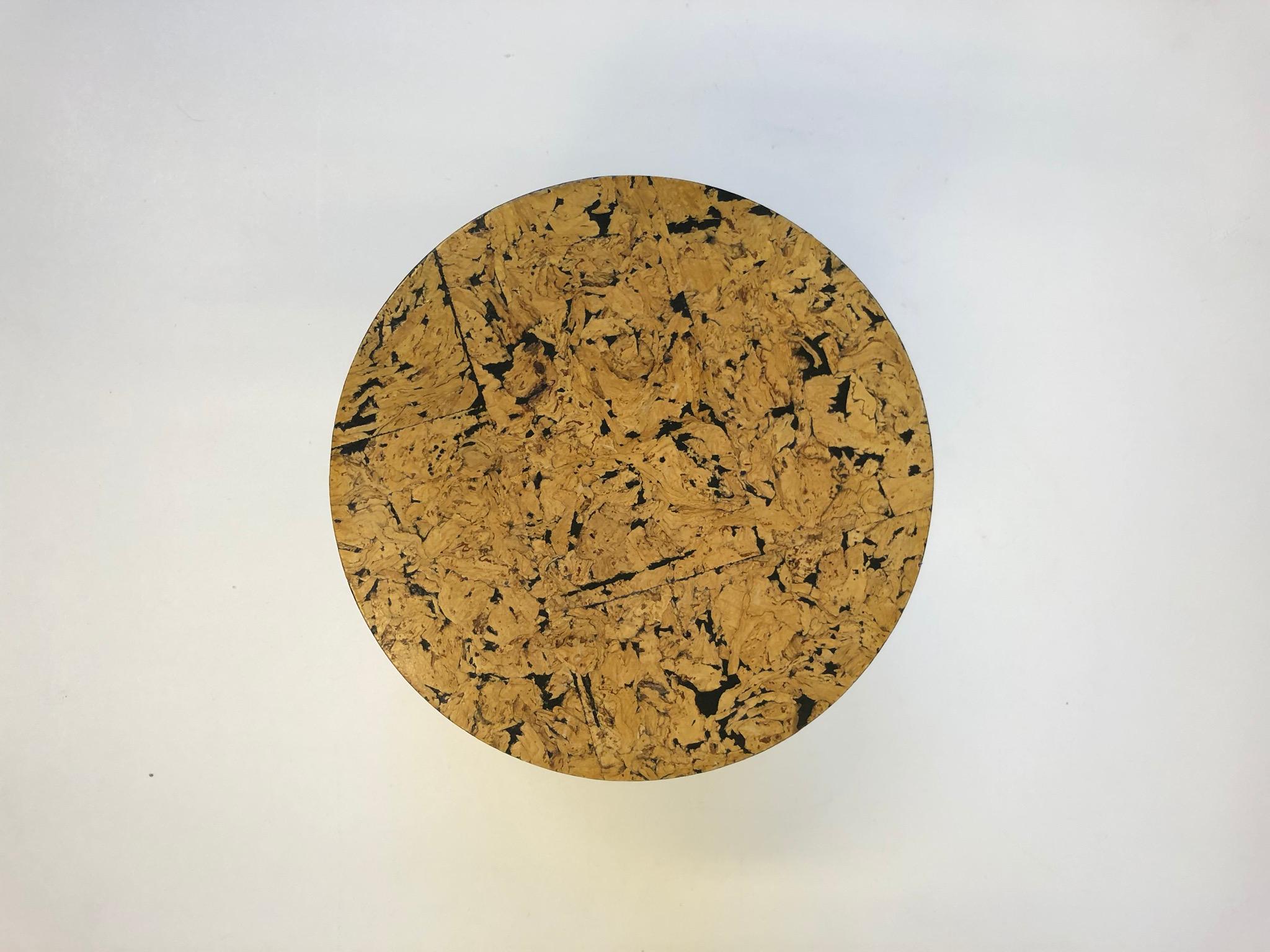 A cool 1970s cork veneer occasional drum table marked ML on brass veneer label.
Dimensions: 11” diameter 16” high.