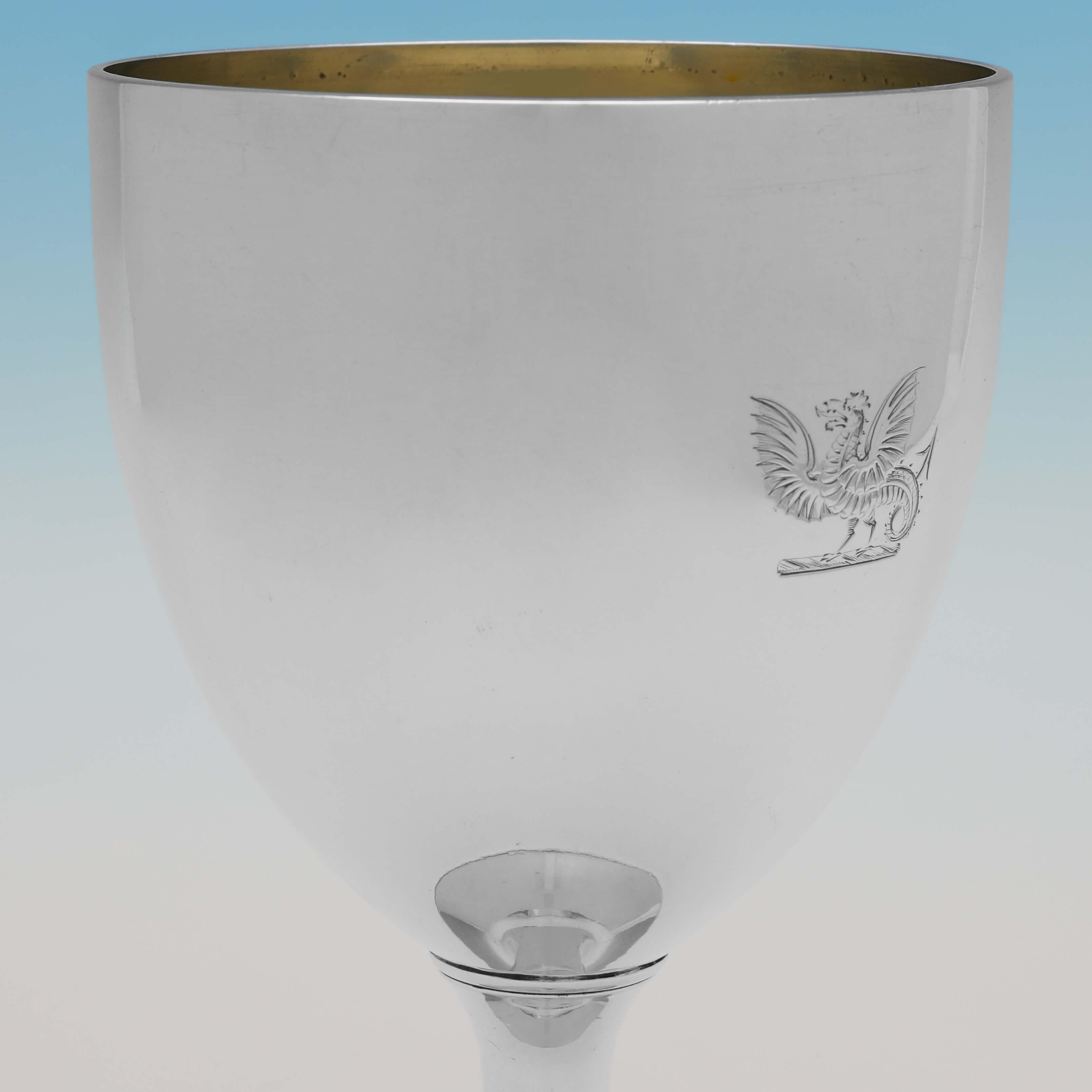 Made in Cork circa 1815 by Carden Terry & Jane Williams, this handsome, Regency period, Antique Sterling Silver Goblet, is plain in style, with a gilt interior and an engraved crest of a Wyvern to the front. 

The goblet measures 6.25