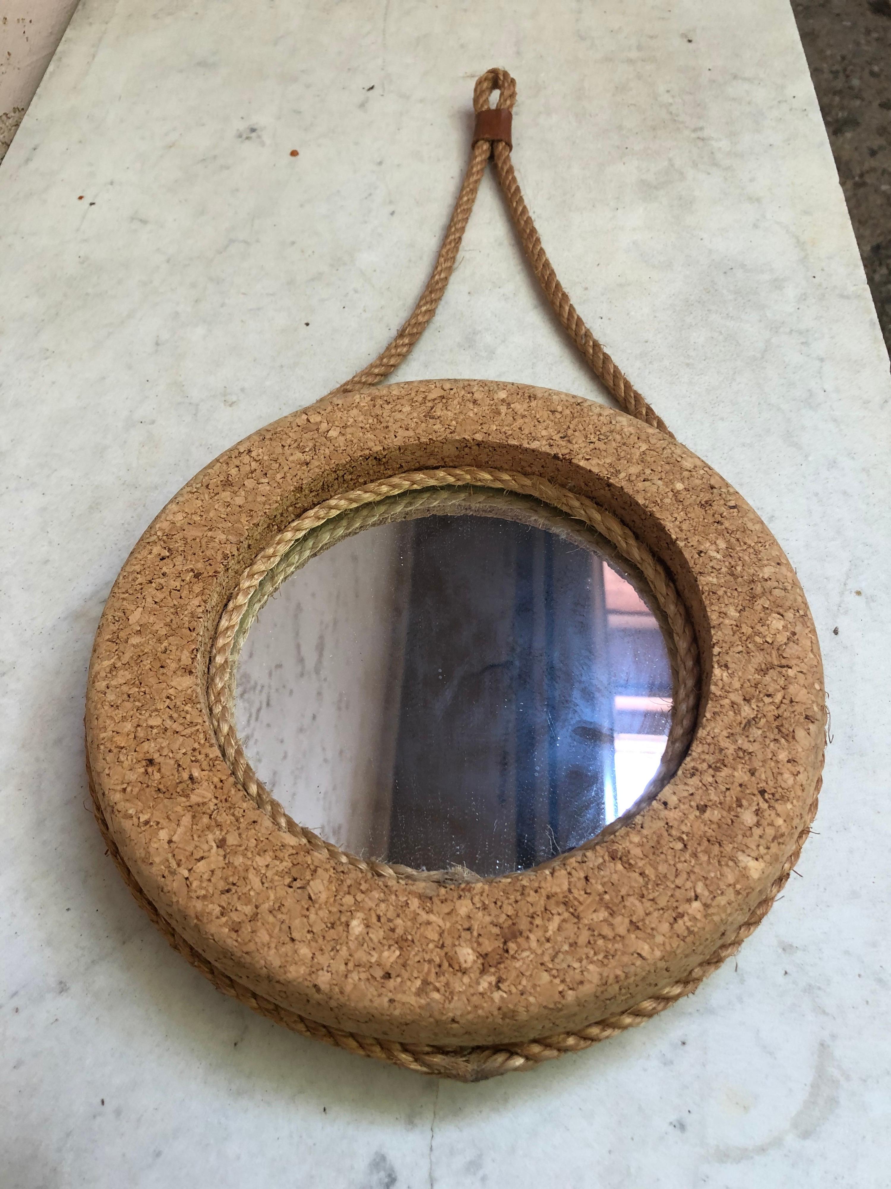 Cork & Rope Mirror Audoux Minet circa 1950.
Measure: Total height with the rope / 20.5 inches.
Diameter of the mirror / 10 inches.