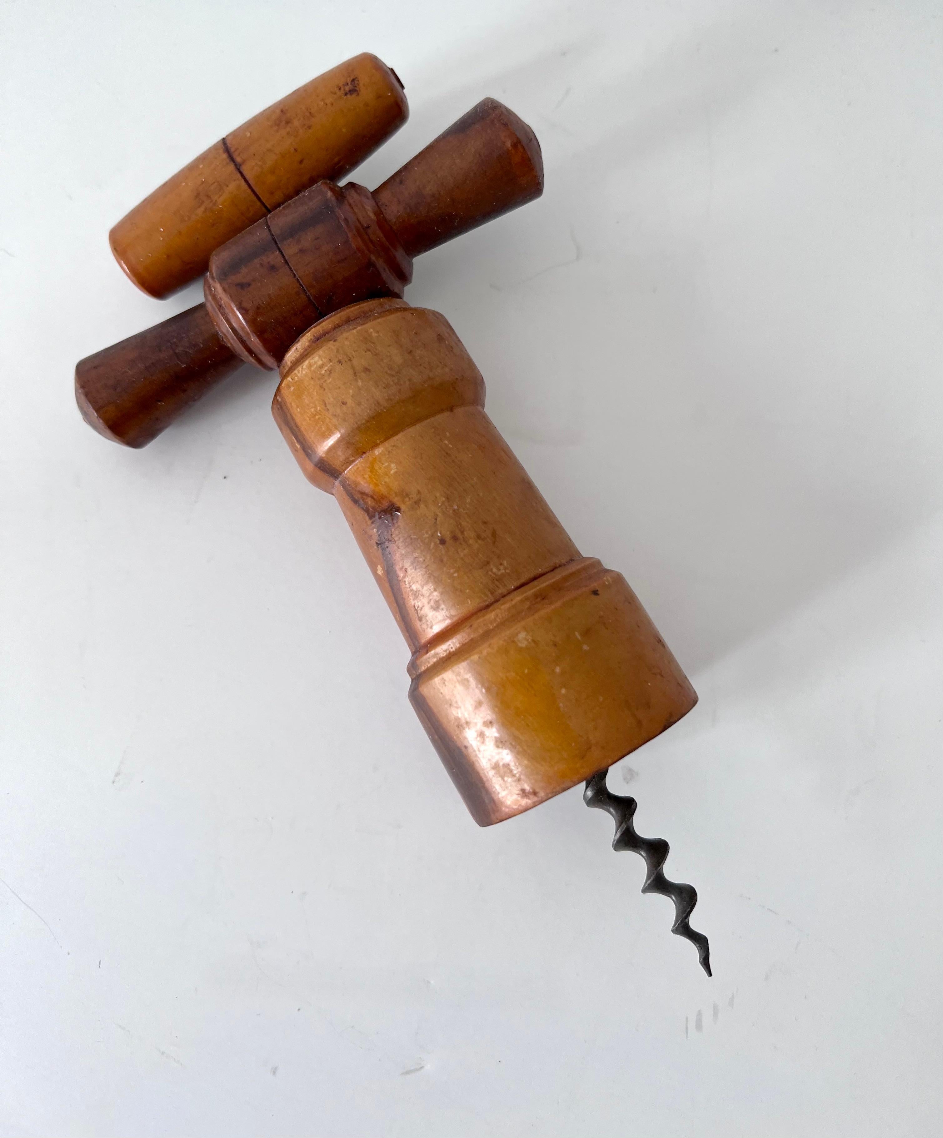 A wonderful vintage cork screw of wood - a compliment to those bars with a bit of old world character. Also makes a nice decorative piece if not functioning.