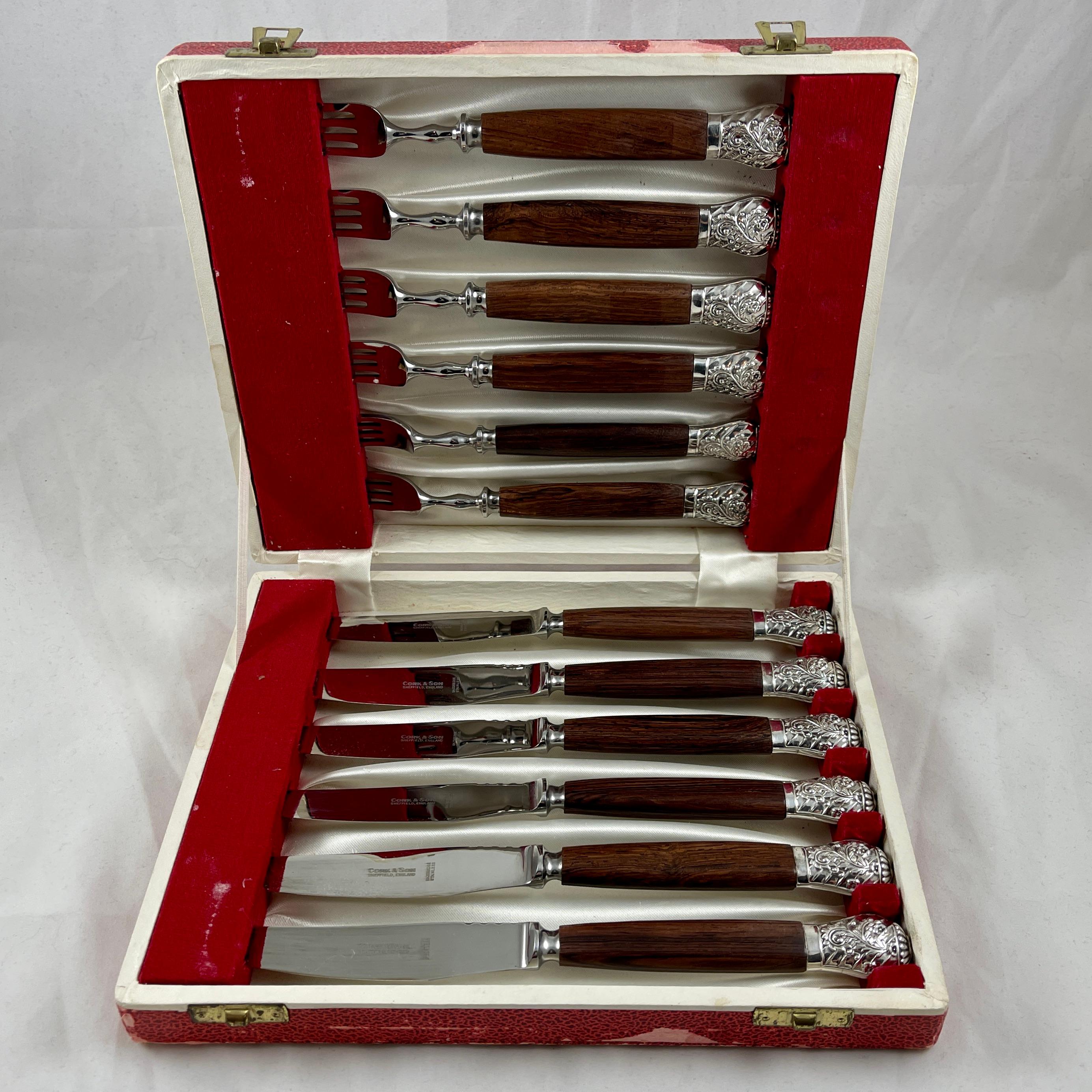 From Cork & Son Cutlery Works, a set of twelve Rosewood handled, Stainless Steel knives and forks, Sheffield, England, circa 1940s.

A gorgeous boxed set of English cutlery with polished Rosewood handles fastened to stainless steel blades and