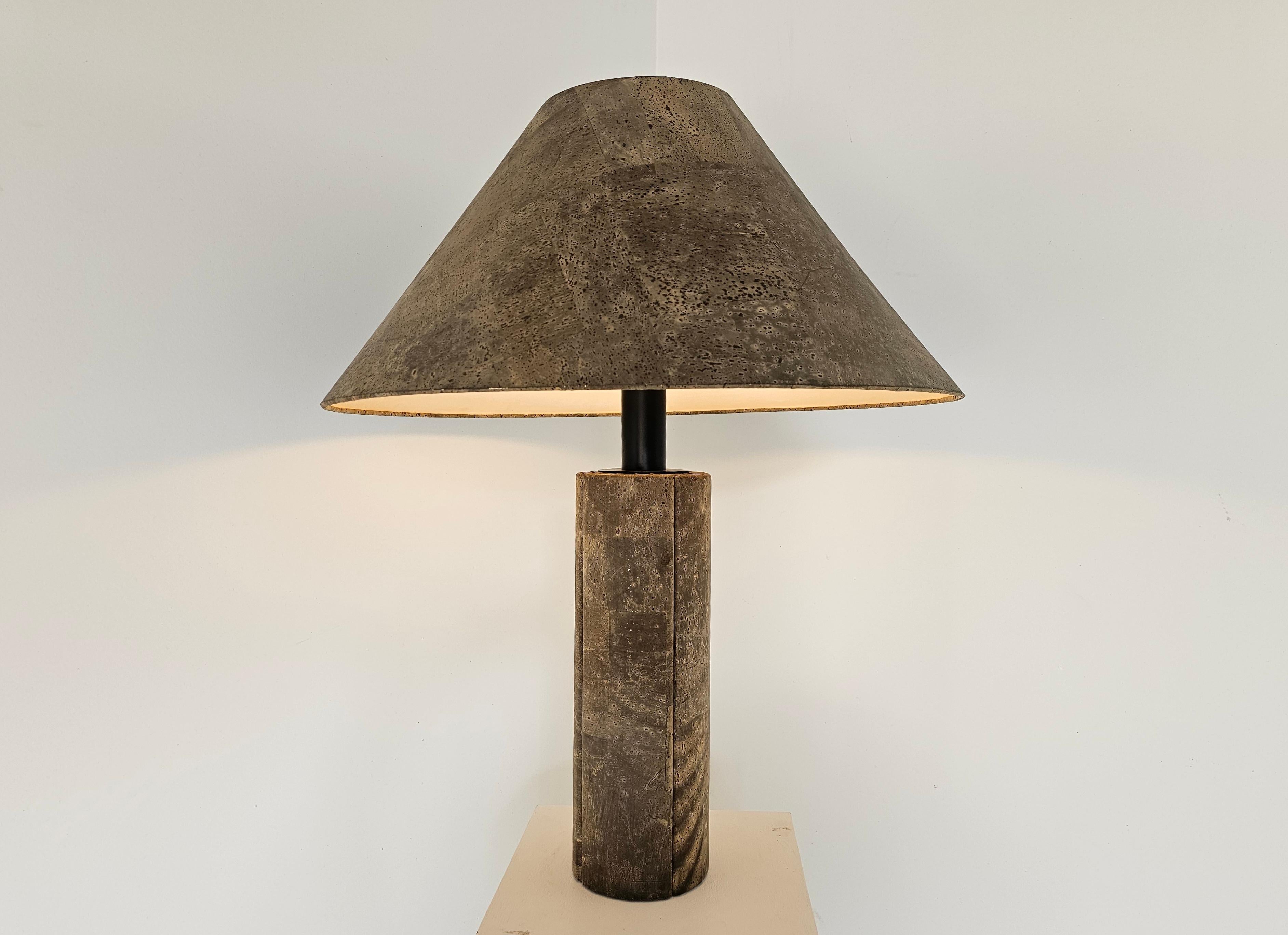 Cork table lamp, Ingo Maurer, Wilhelmus Zanoth, Germany, 1974

This large table lamp was designed by Wilhelm Zanoth and Maurer together in 1974. The lamp’s base and shade are made from thin slices of dark cork sheet veneer. The lamp’s Minimalist