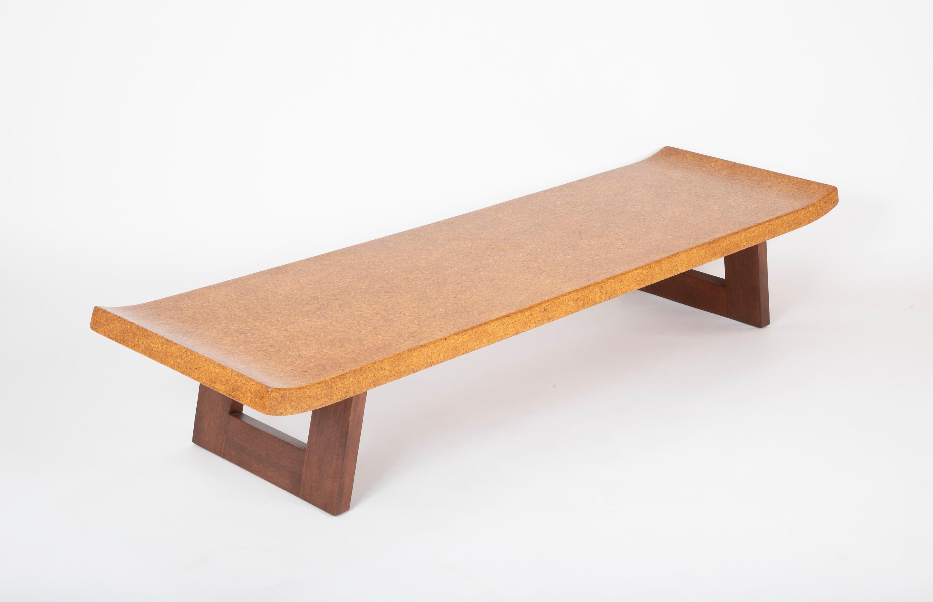 A cork top coffee table designed in the 1950s by Paul Frankl. Produced by the Johnson Furniture Company, USA, circa 1948 lacquered cork, lacquered mahogany.
  