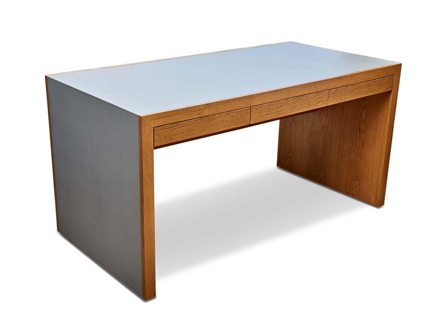 The Parkman desk features a Parsons-style waterfall shape with cork on the top and sides and three drawers. Available in American walnut or white oak and 5 different cork colors.

The Lawson-Fenning Collection is designed and handmade in Los