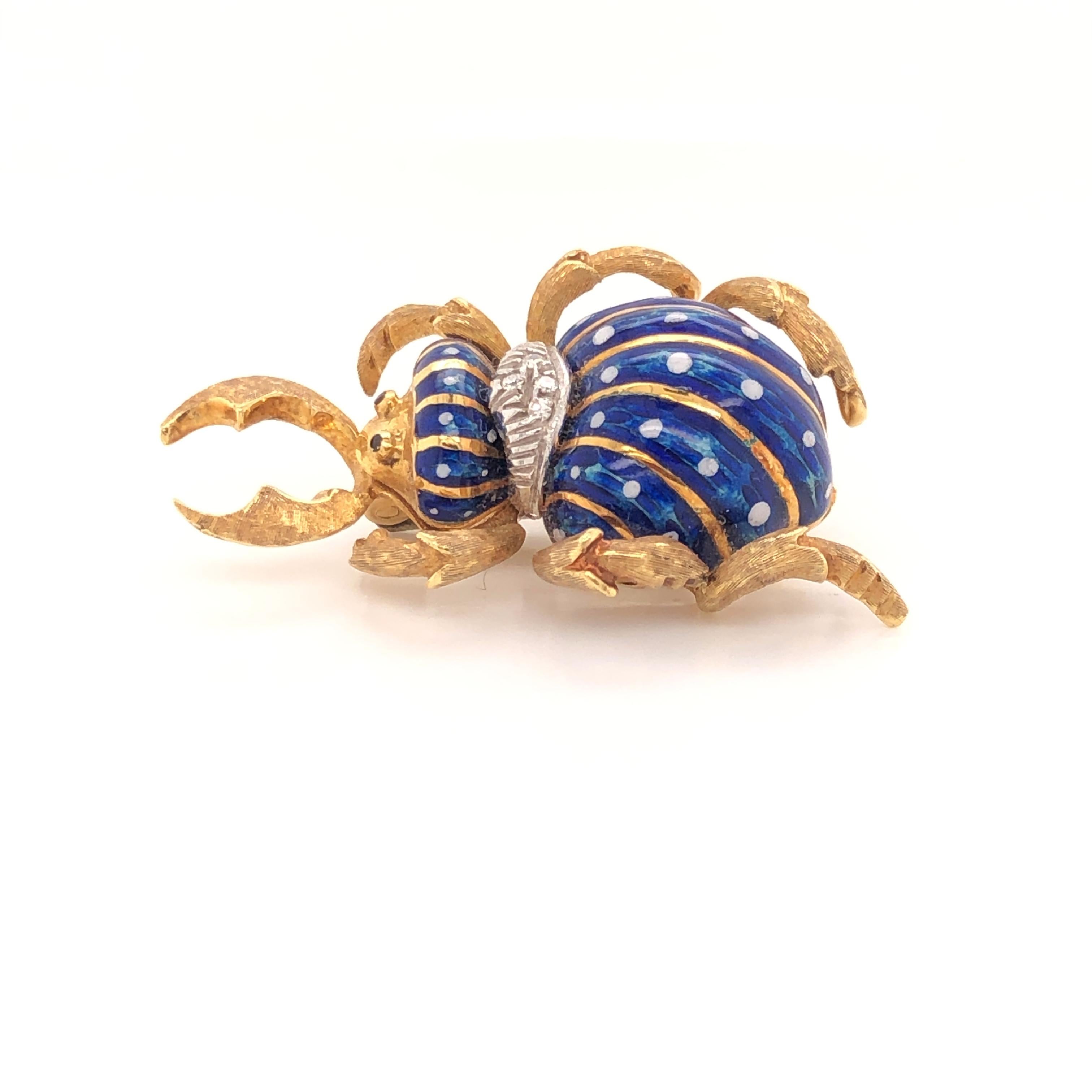 Beautifully constructed brooch by Corletto
This beetle bug is gorgeous, but looks like he has a strong bite.  His body is blue enamel with white spots.  There are a few diamonds in his collar.  He has 3 sets of legs and a set on pinchers in front. 