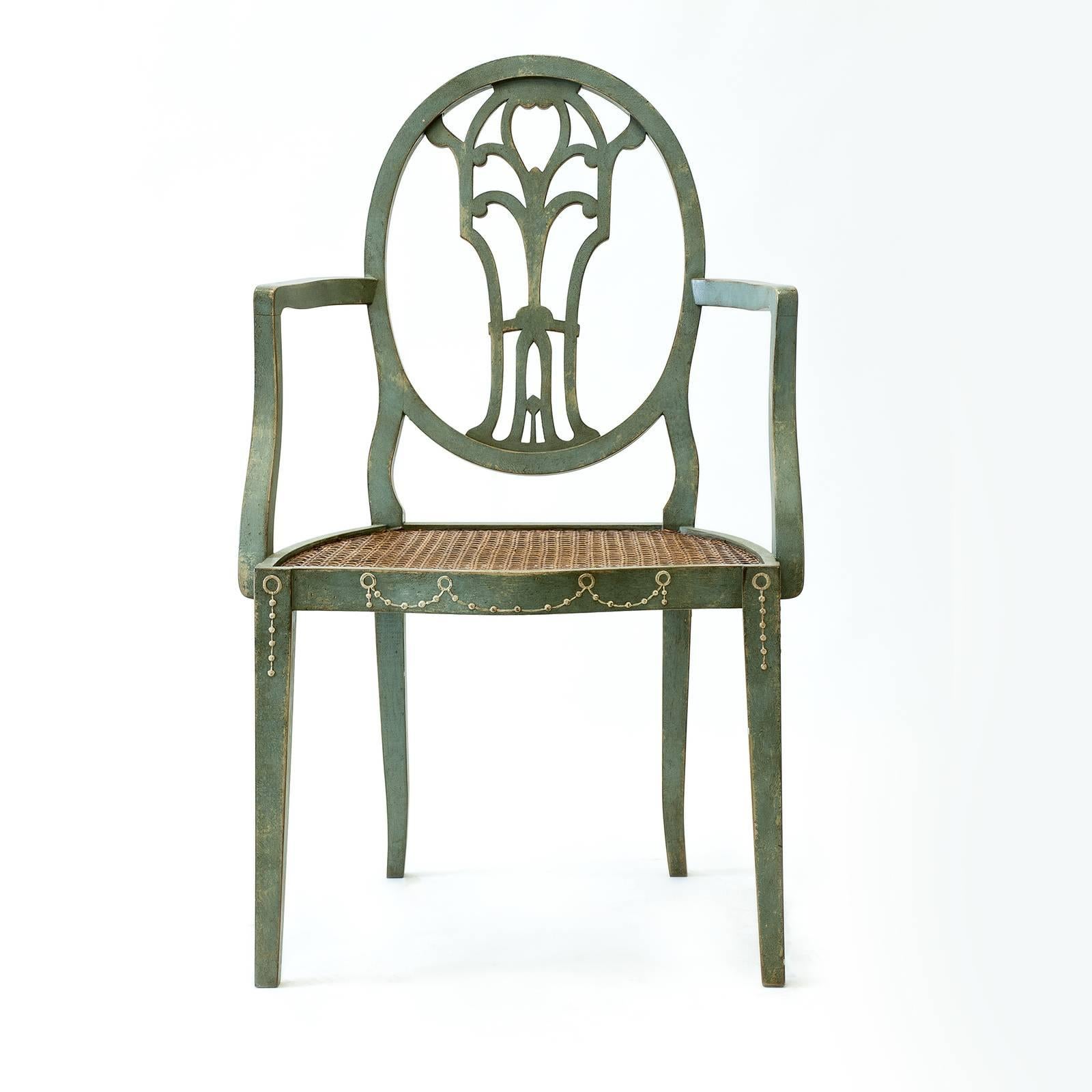 The classic design of this exclusive dining chair with armrests will complement a broad variety of interiors, offering both sophistication and comfort. The solid wood frame boasts a hand painted antique sage green finish, which enhances the