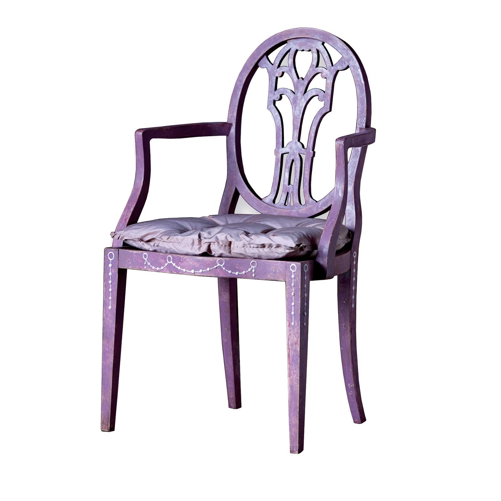 Handcrafted of wood and hand painted in a stunning mauve color, this Venetian style dining arm chair brings a recognizable look into any interior. The oval backrest features a sophisticated carving that, combined with the open armrests, create a