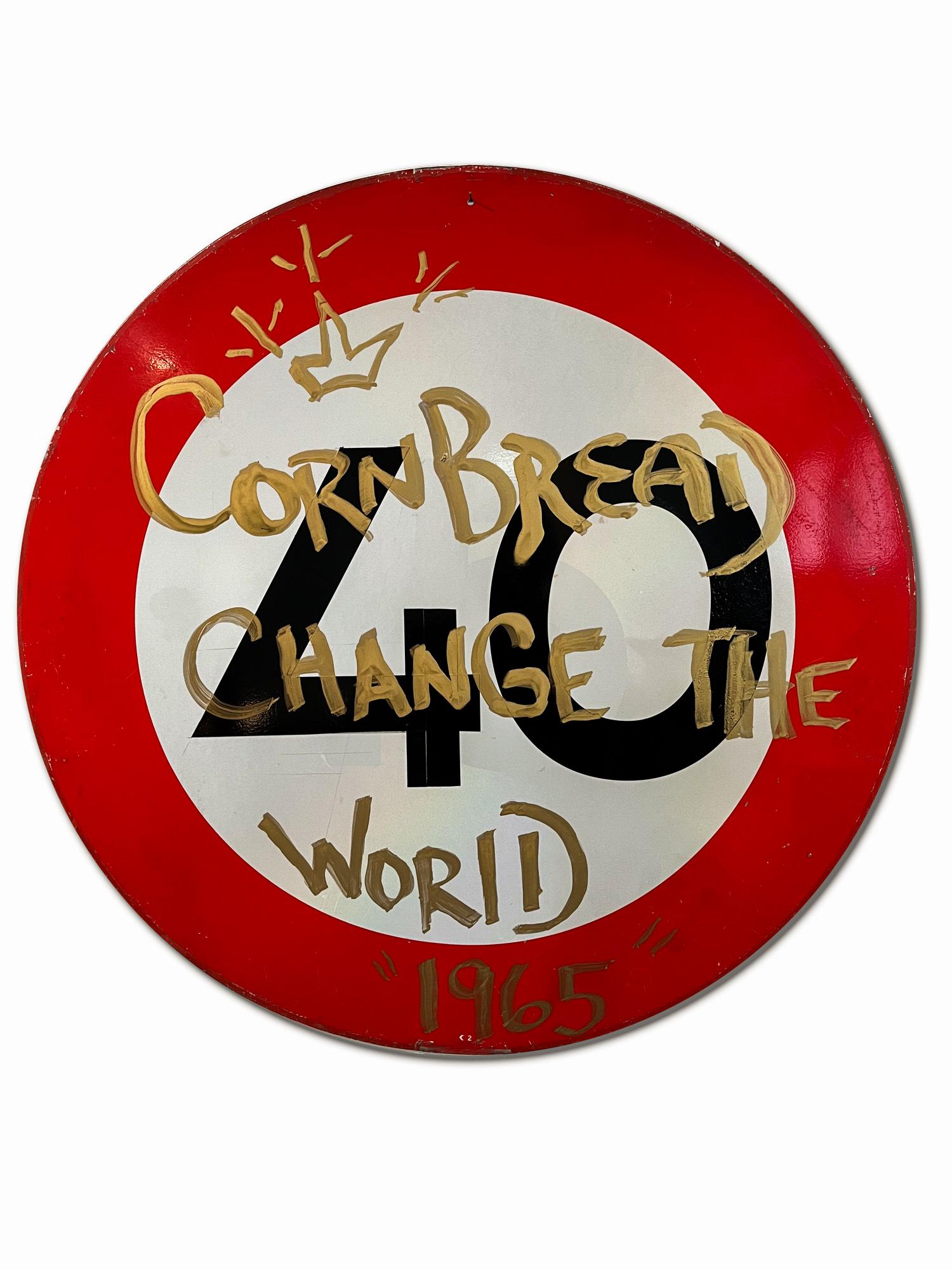 Dieses Kunstwerk mit dem Titel "Cornbread Change The World 1965 Shield" ist ein Originalkunstwerk von Cornbread, das mit Acrylfarbe auf einem ausgedienten Amsterdamer Straßenschild gemalt wurde. Das Stück hat einen Durchmesser von 80 cm / 31,5
