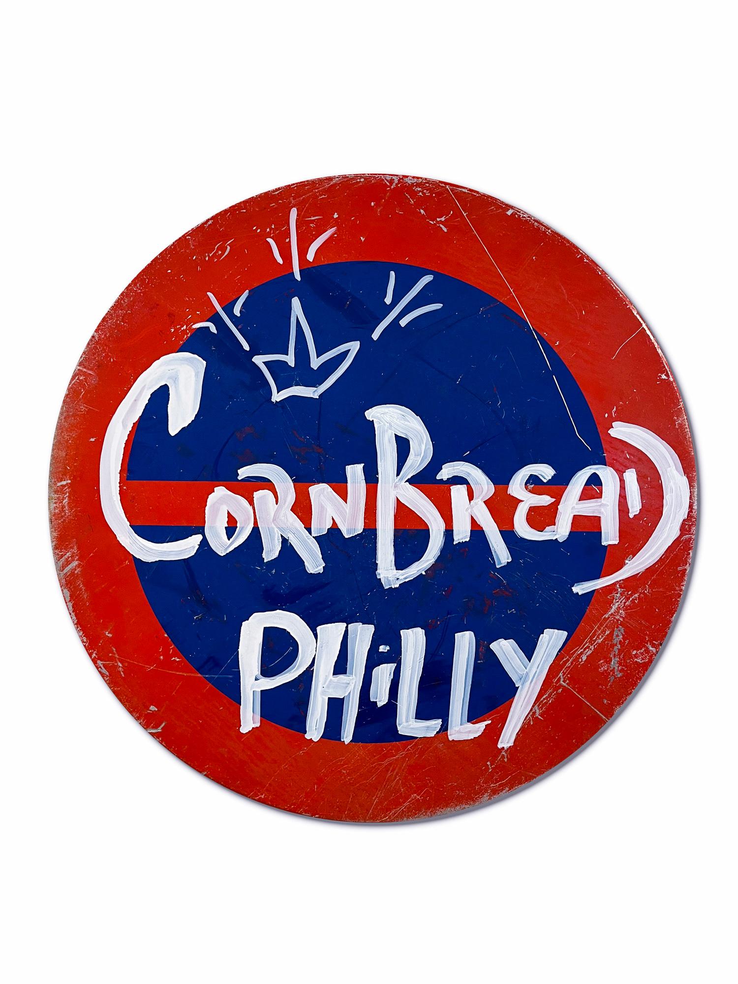 This artwork titled "Cornbread Global Phenomenon Shield" is an original artwork by Cornbread made of acrylic paint on a retired Amsterdam street sign. The piece measures 80cm / 31.5in diameter. 

Darryl McCray, known by his tagging name,