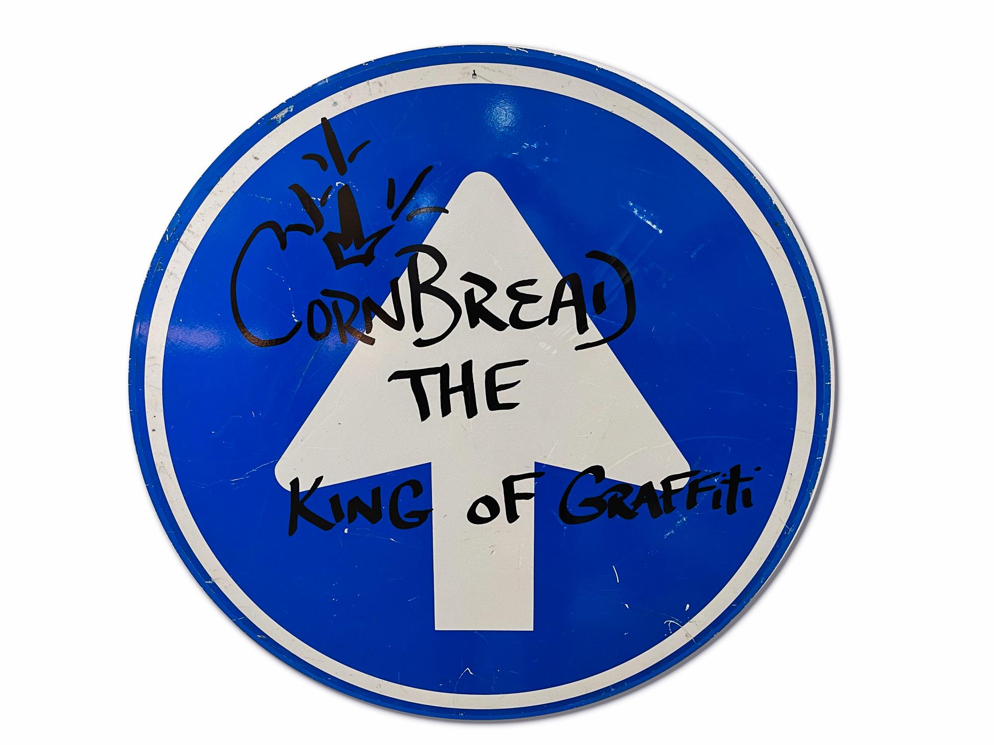This artwork titled "Cornbread The King Of Graffiti Shield (Blue)" is an original artwork by Cornbread made of acrylic paint on a retired Amsterdam street sign. The piece measures 80cm / 31.5in diameter.

Darryl McCray, known by his tagging name,
