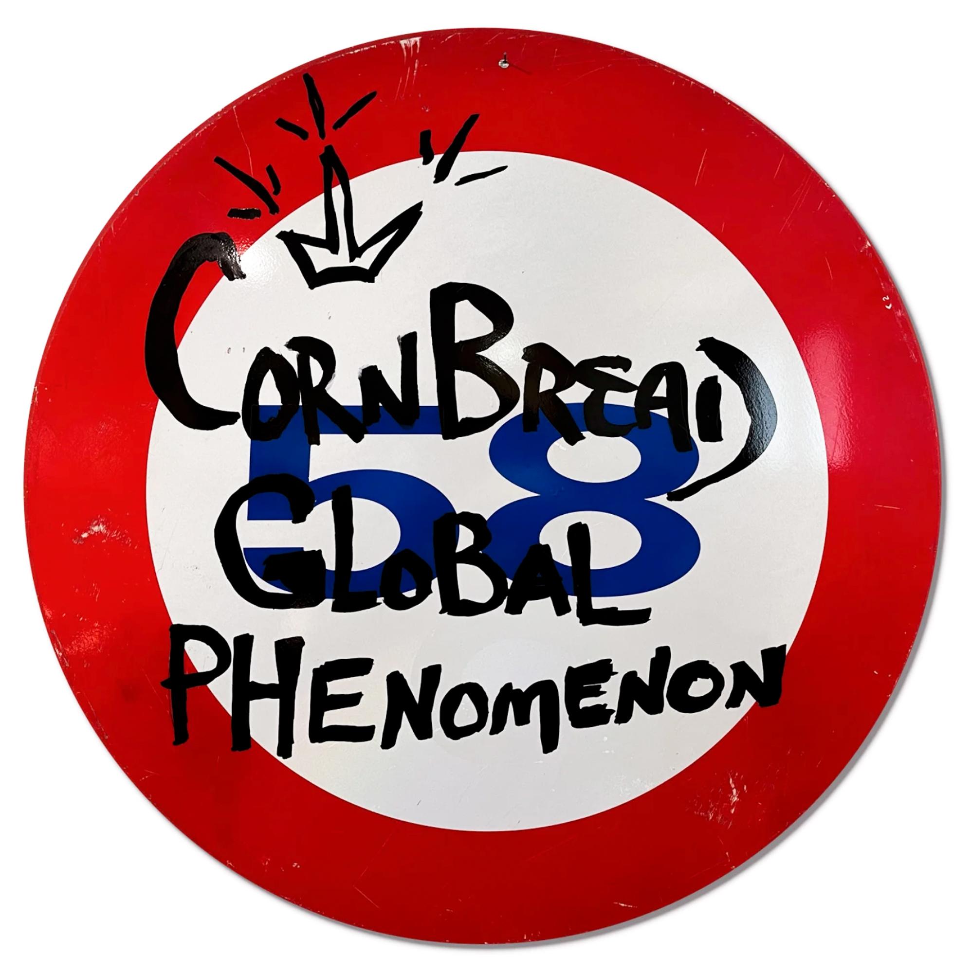 This artwork titled "Cornbread Global Phenomenon Shield" is an original artwork by Cornbread made of acrylic paint on a retired Amsterdam street sign. The piece measures 80cm / 31.5in diameter and ships with a Gallery-issued Certificate of