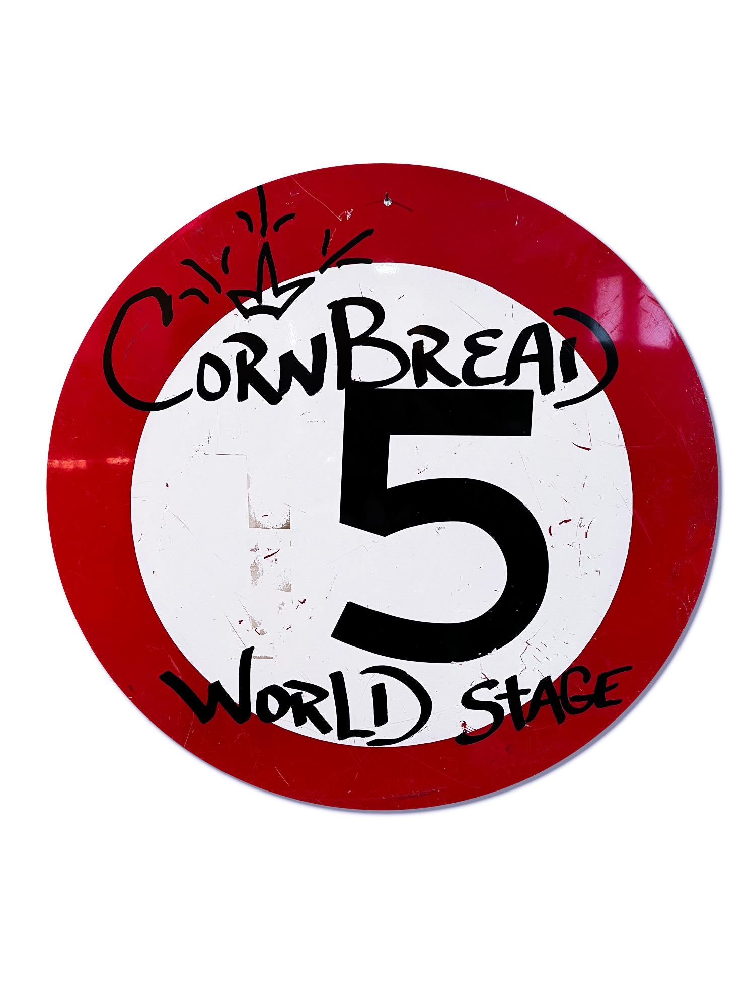 This artwork titled "Cornbread World Stage Shield" is an original artwork by Cornbread made of acrylic paint on a retired Amsterdam street sign. The piece measures 60cm / 23.5in diameter. 

Darryl McCray, known by his tagging name, “Cornbread,” is a