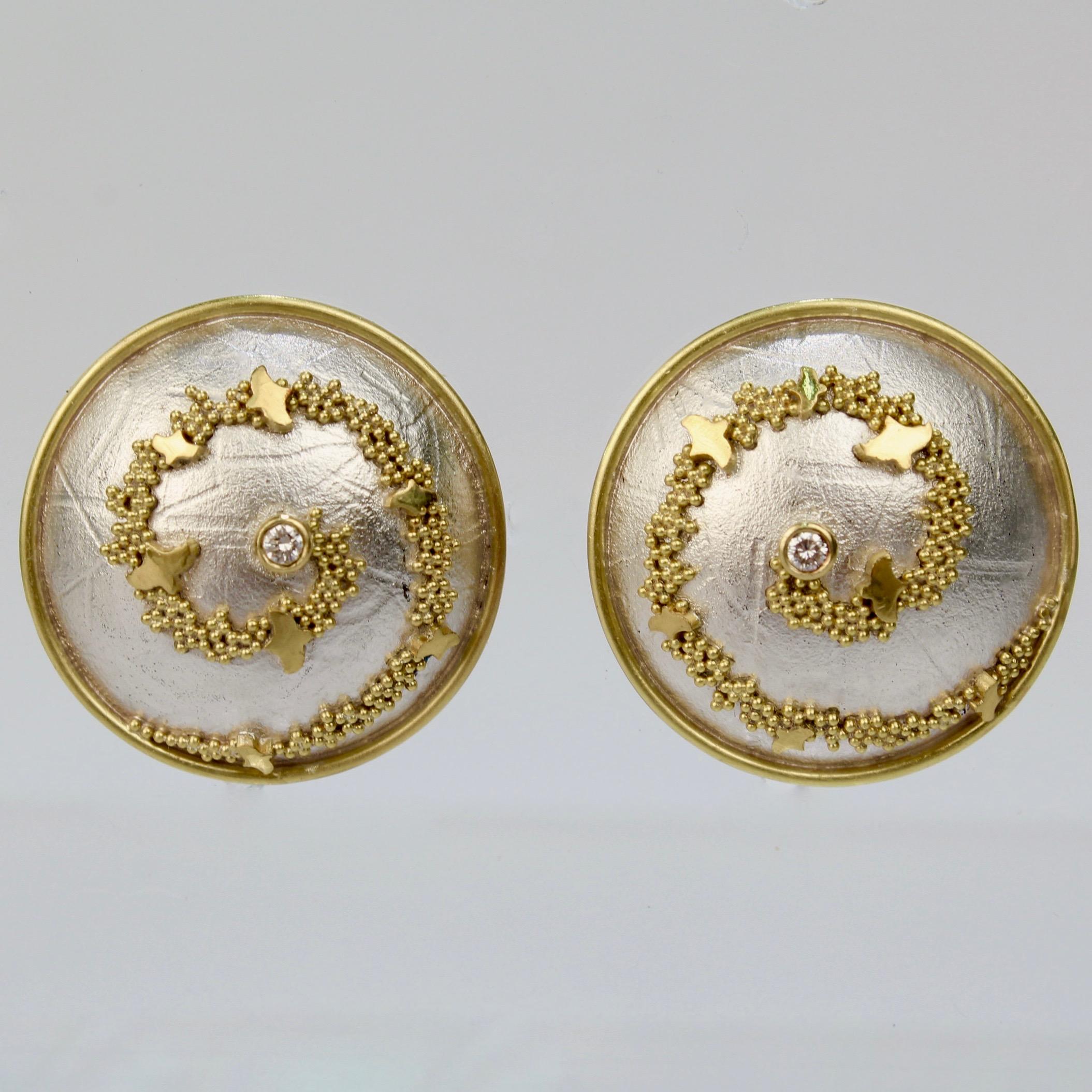An elegant pair of Cornelia Goldsmith round earrings.

Each in sterling silver with a spiral of high-karat granulated gold beads and set with a small round white diamond.

Goldsmith is a renowned California contemporary jewelry maker and a member of