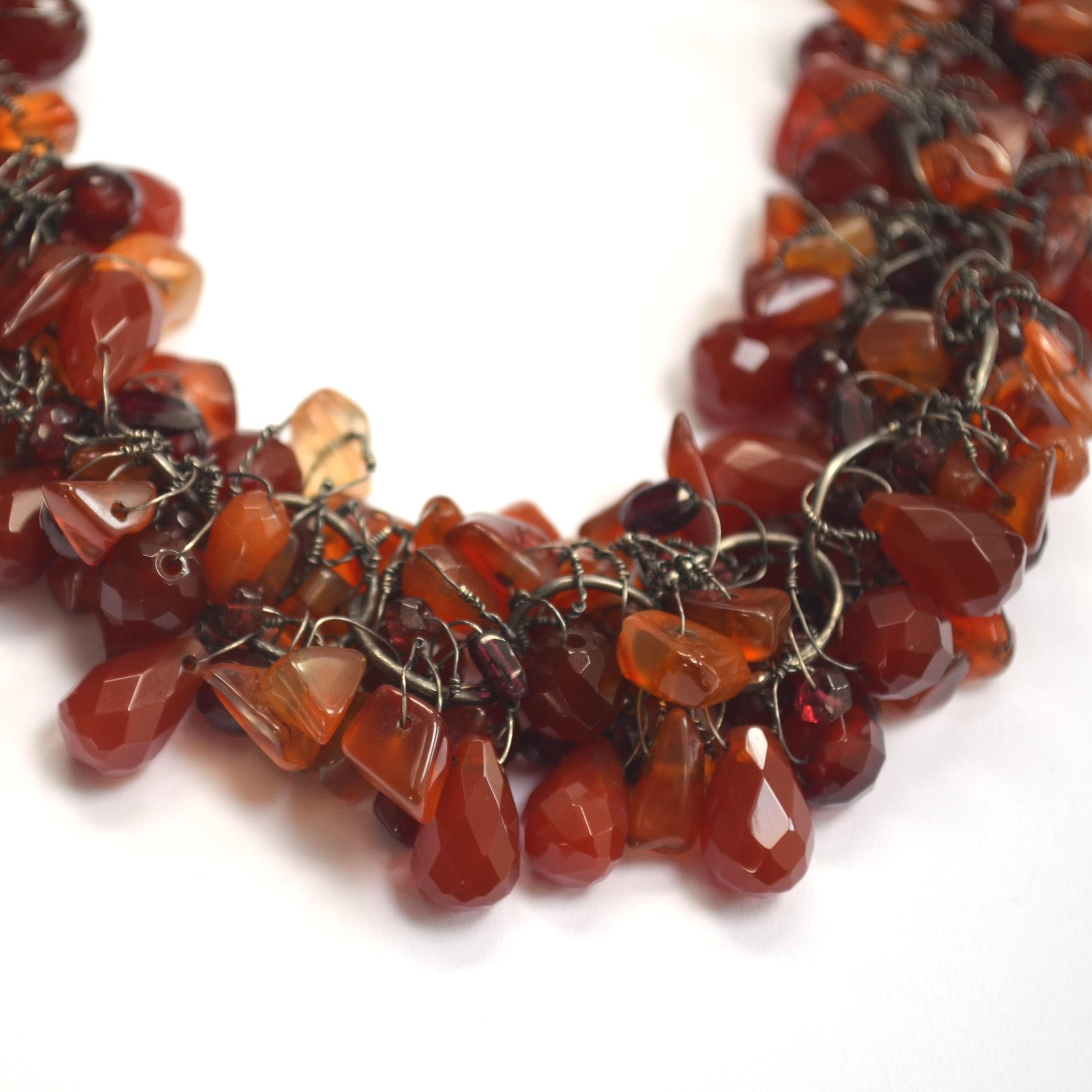 This stunning handmade textured chain has had each individual bead attached by hand in Disa Allsopp's London studio. Featuring a hand picked combination of cornelian briollettes, rounds and chips with rhodolite garnet marquis cut beads and garnet