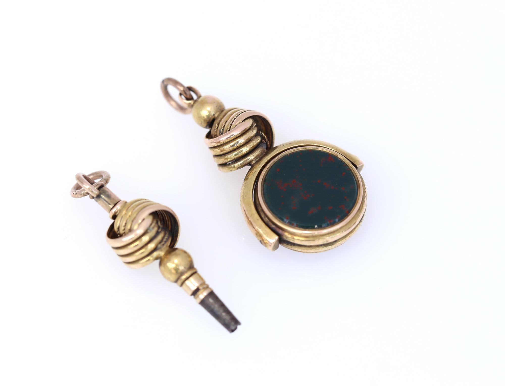 Cornelian Swivel Fob and Watch Key 14K Gold Set for a Charm Bracelet. A set of late 19th-century swivel signet fob and a watch key. 
The Signet is blank, so we can arrange for your initials to be engraved here. Unique opportunity to start your own