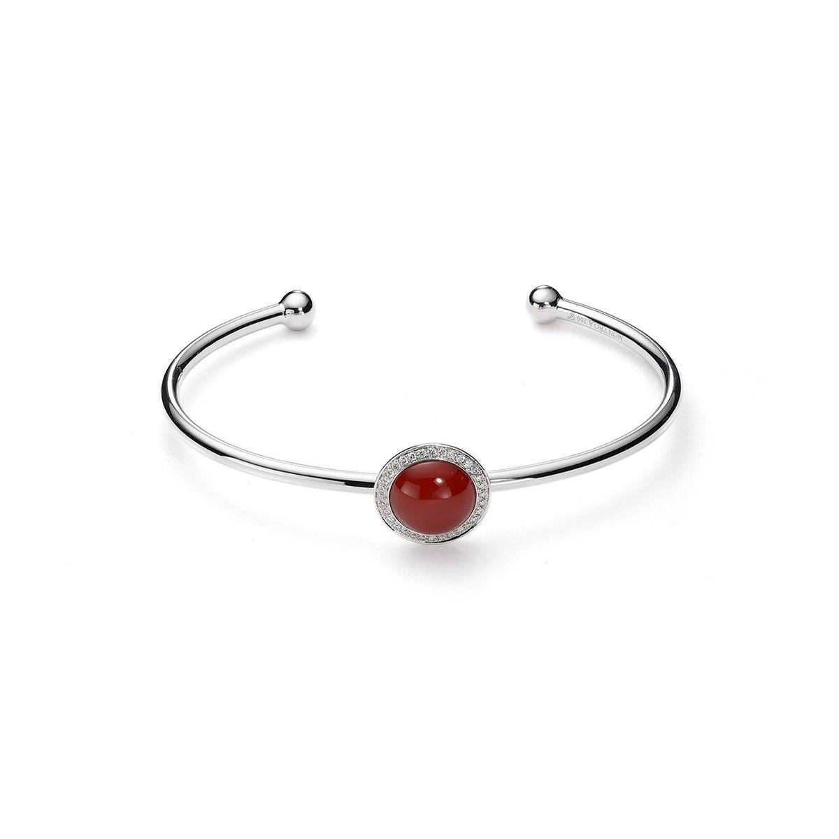 Bangle in 18kt white gold set with one cornelian cabochon cut 2.58 cts and 32 diamonds 0.16 cts          