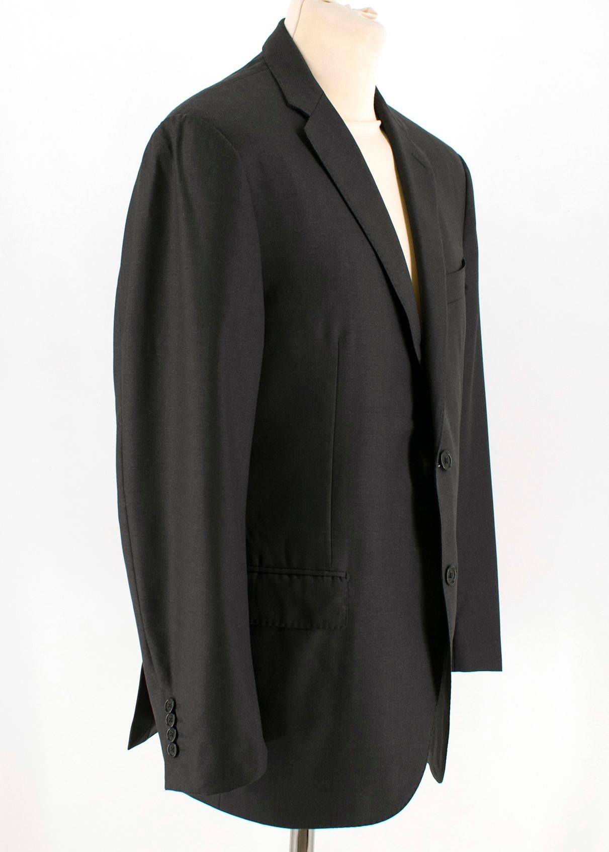 Corneliani Anthracite Grey Single Breasted Suit

Jacket:
- Single breasted jacket
- Long sleeves
- Padded shoulders
- Button up cuffs
- Peak lapel collar
- Double back vent
- Two front flap pockets
- Chest welt pocket
- Three internal