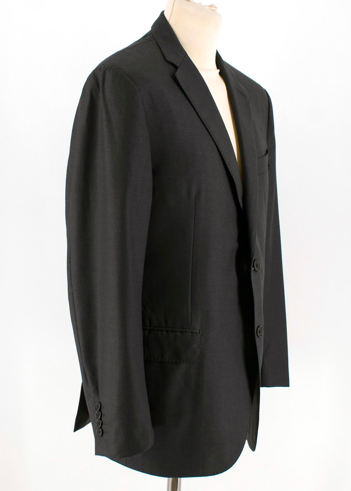 Corneliani Anthracite Grey Single Breasted Suit

Jacket:
- Single-breasted jacket
- Long sleeves
- Padded shoulders
- Button up cuffs
- Peak lapel collar
- Double back vent
- Two front flap pockets
- Chest welt pocket
- Three internal