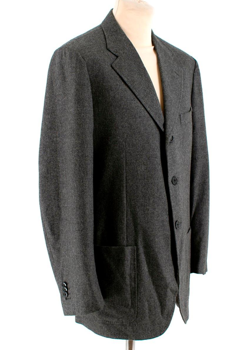 Corneliani Men's Grey Virgin Wool Single Breasted Suit 

Jacket:
- Longline
- Soft touch 
- Button fastening
- Pockets at sides and one handkerchief pocket

Trousers:
- Button pockets at back
- Belt loops and button fastening

Materials:
Outer
100%