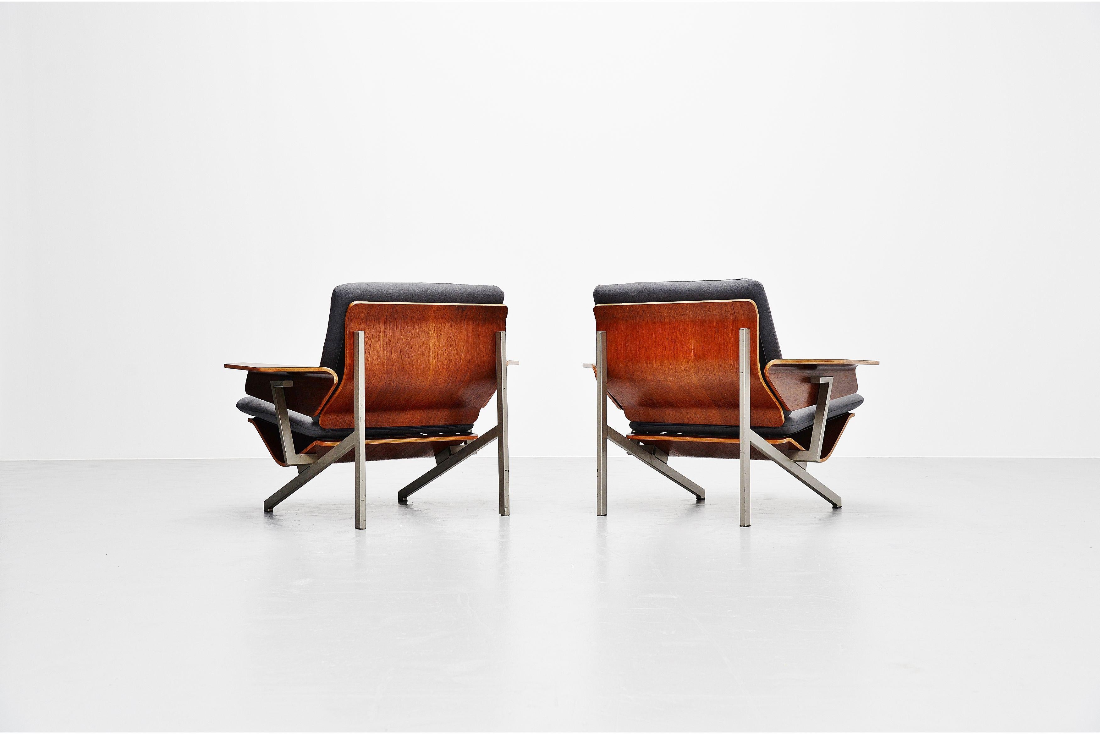 Rare set of lounge chairs model FM50 designed by Cornelis Zitman and manufactured by Pastoe UMS, Holland 1964. The chairs have a grey painted tubular metal frame, the seats and arm rests are made of teak finished plywood, in the seats and backs are