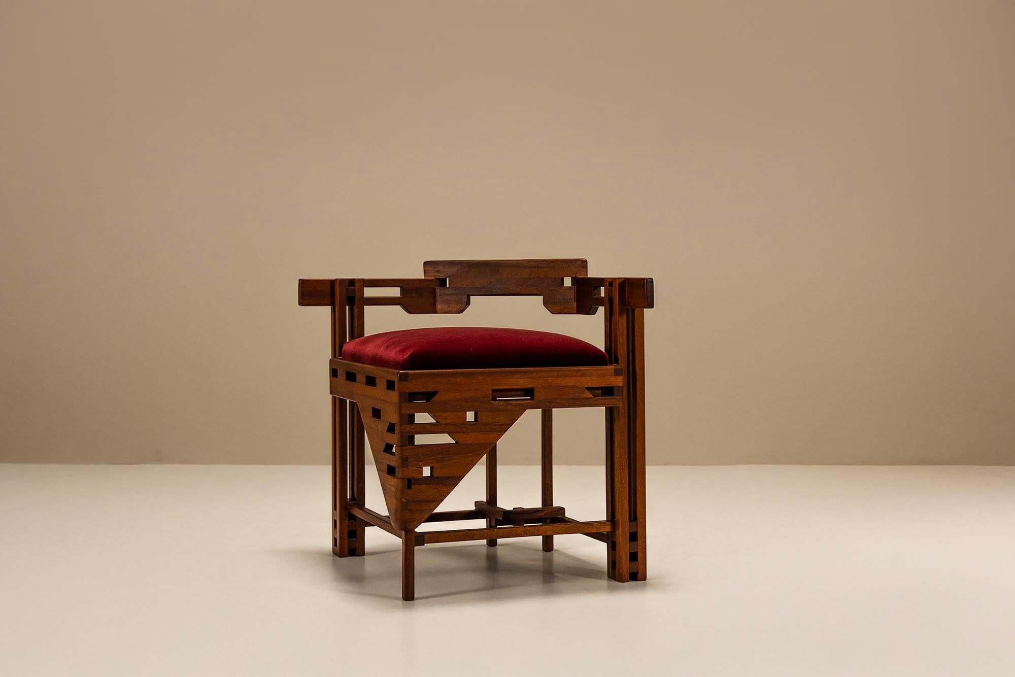 From our curated selection comes this rare corner chair, created in the spirit of early 20th-century design.

Design
This chair features a distinct triangular seat construction, giving it a compact and graphic appearance. Crafted in richly stained